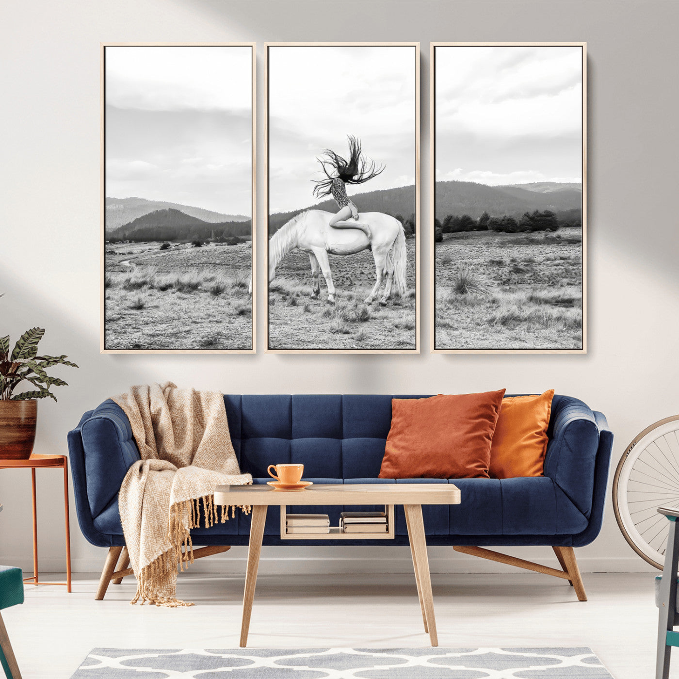Black and white photo of a woman on a white horse in moody tones, ideal for Western Boho or modern rustic-style home decor.