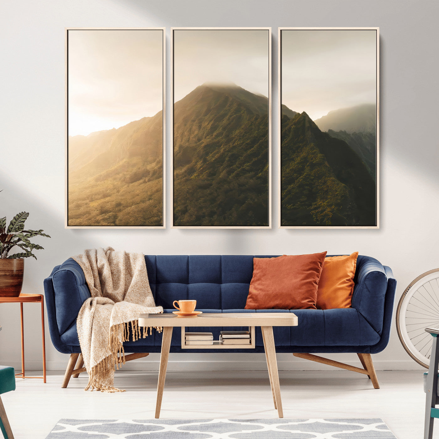 Sunlit mountain peak with mist rolling over its rugged slopes, bathed in golden light, creating a warm and tranquil nature-inspired scene.