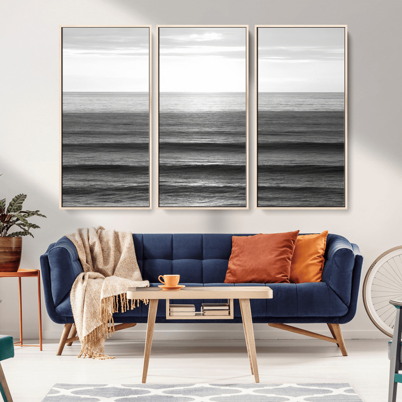 Minimalist black and white ocean view with layered waves reflecting sunlight, evoking a sense of calm and coastal serenity.