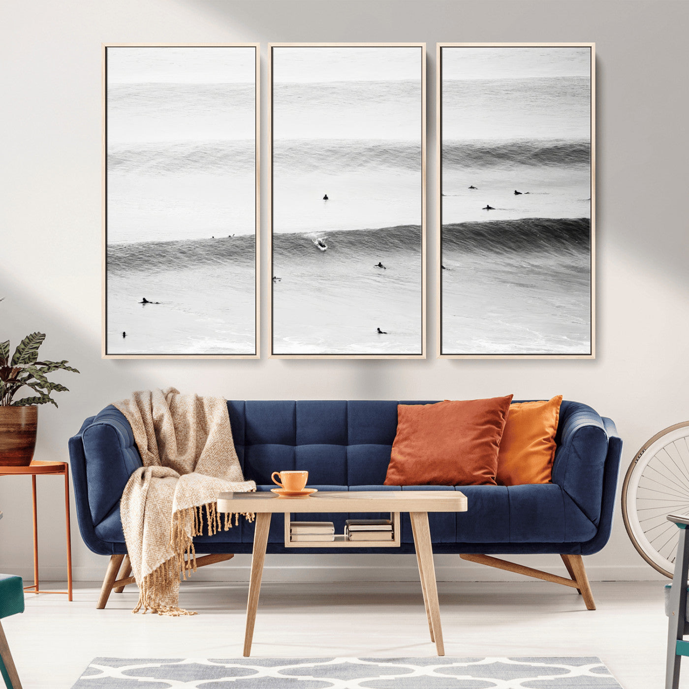 A monochrome photograph of swimmers gliding through gentle ocean waves, evoking a sense of calm and movement.