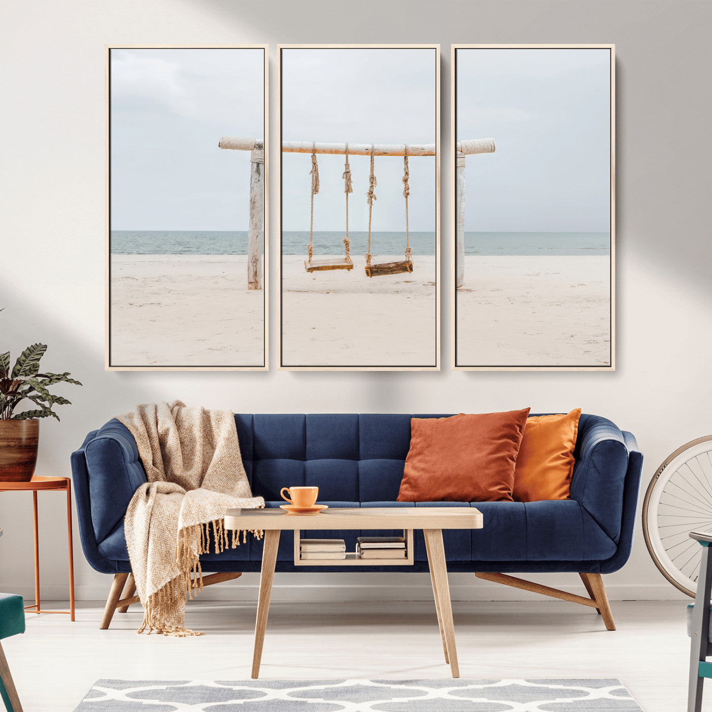 A rustic wooden beach swing stands on a serene sandy shore with an ocean horizon in the background, creating a tranquil and dreamy coastal escape.