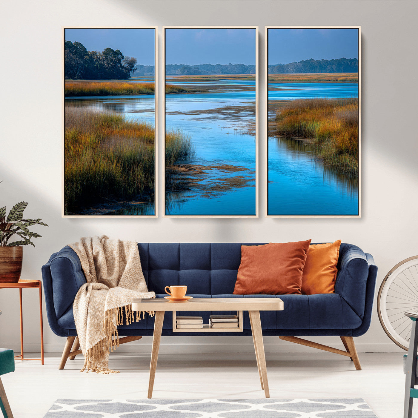 A peaceful marshland scene with calm blue water reflecting the surrounding grasses and trees, capturing the beauty of nature in a serene landscape.