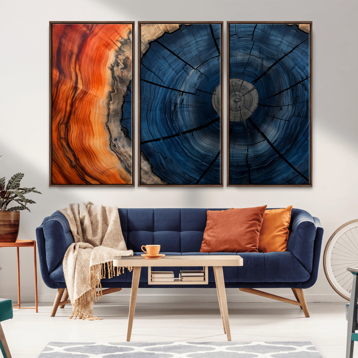 A captivating close-up of a tree trunk, showcasing its concentric rings in rich shades of blue, orange, and brown, highlighting the organic patterns of natural wood.