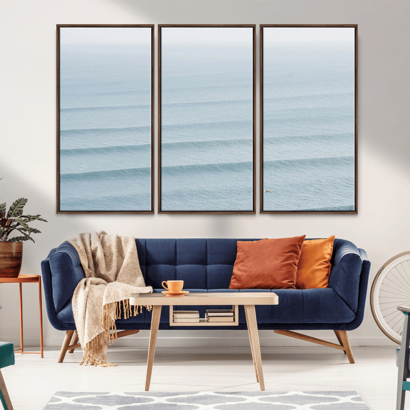 Framed canvas of repeating ocean waves with a distant solo surfer, ideal for minimalist ocean or calm coastal wall decor.