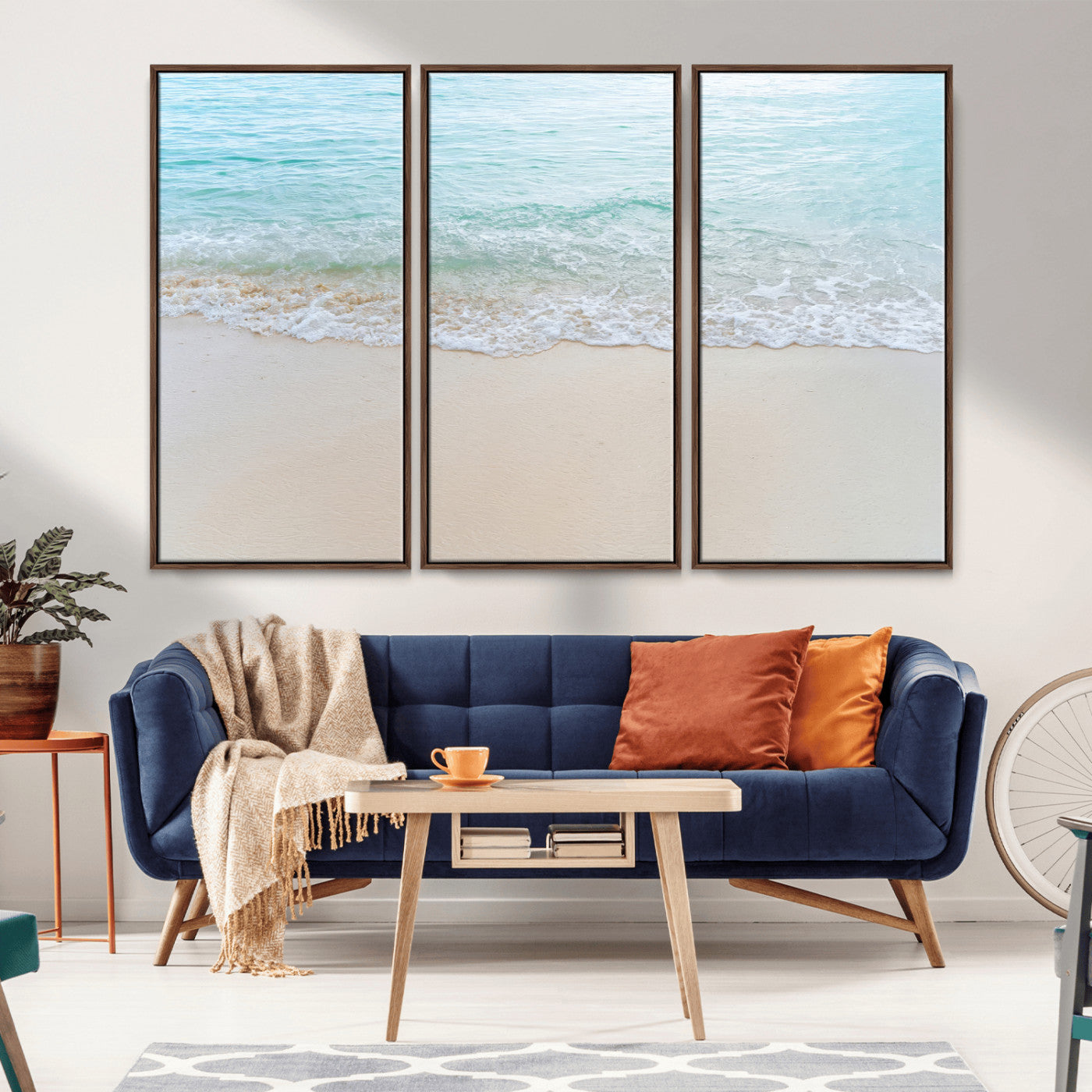 Soft shoreline with gentle aqua waves on smooth sand, ideal for minimalist coastal or pastel ocean-inspired home wall decor.