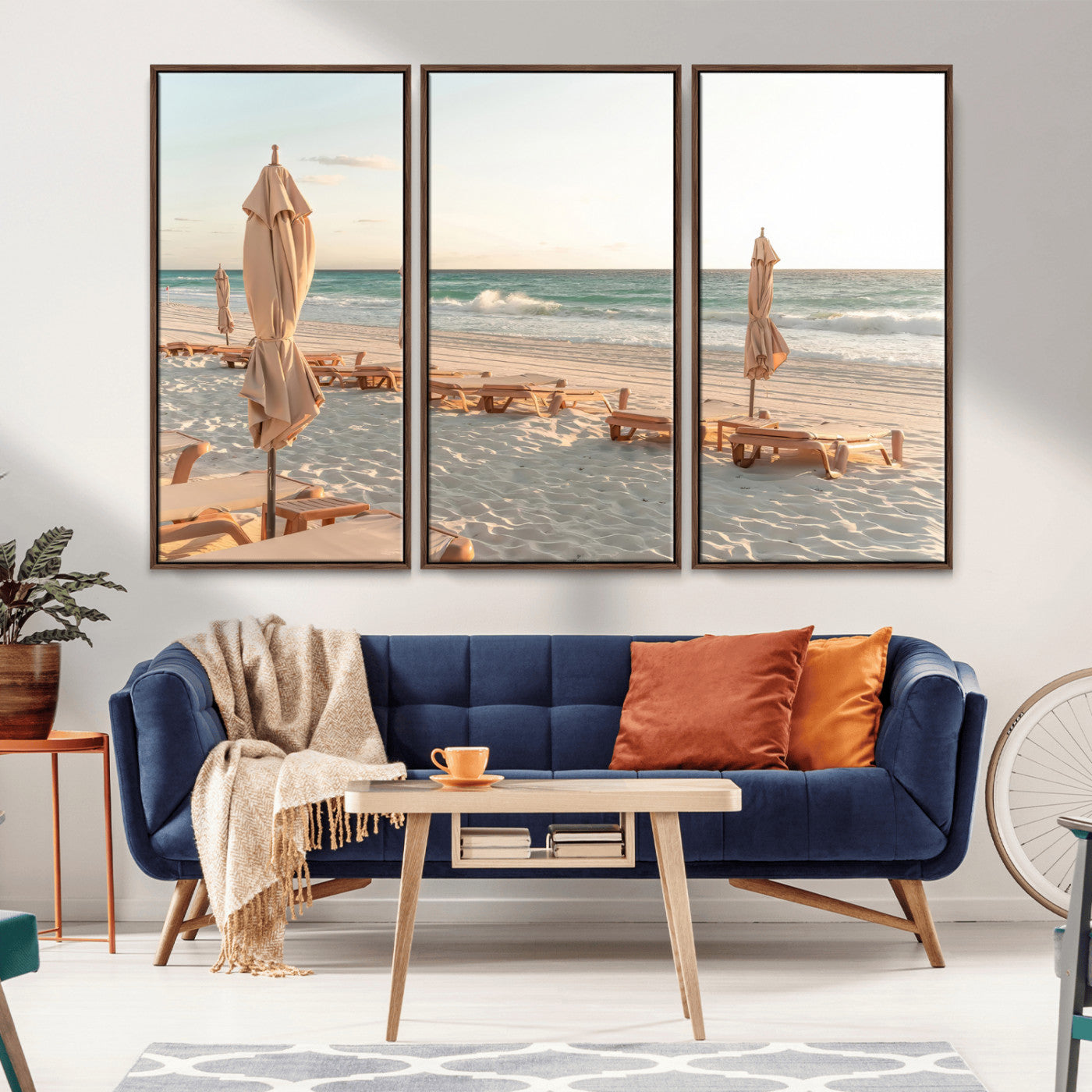 Minimalist photo of empty beach loungers and umbrellas on soft sand, ideal for calm seaside or pastel coastal-style home decor.