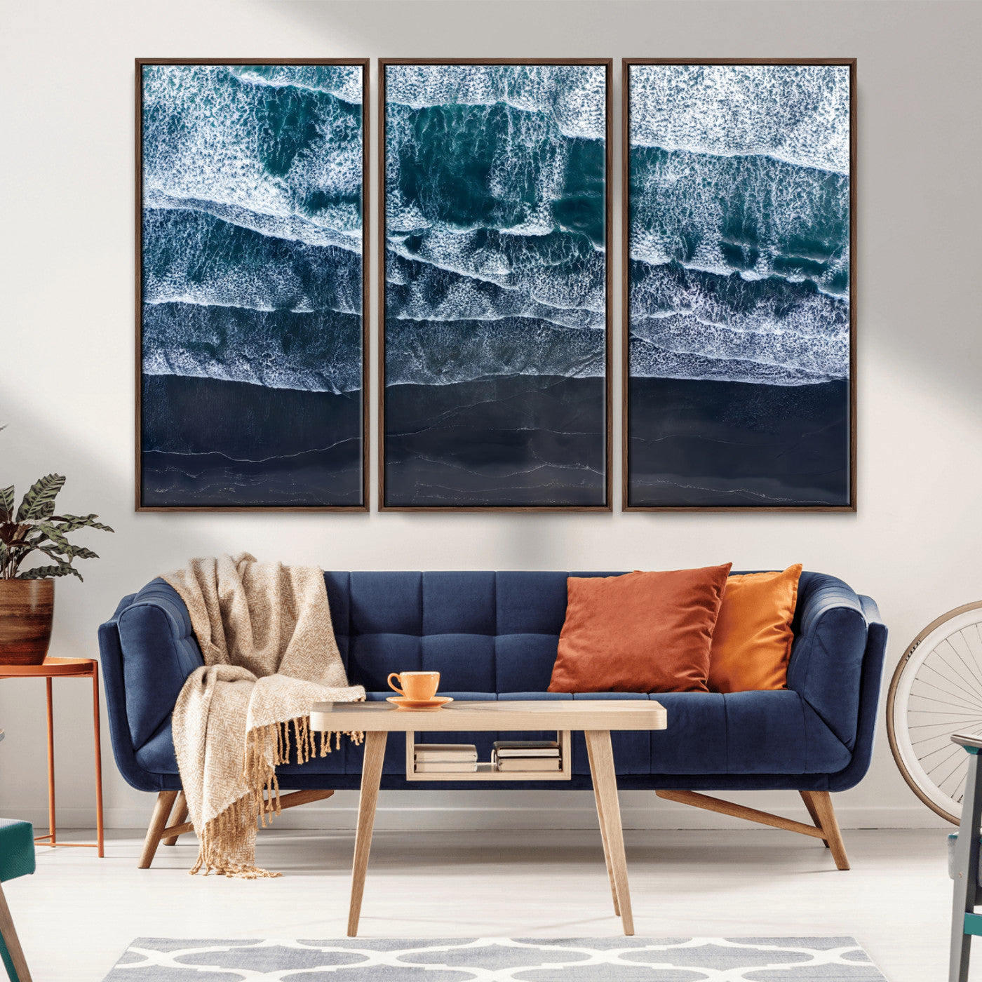 Canvas of aerial ocean waves crashing onto a black sand beach in moody tones, ideal for modern coastal or minimalist home decor.
