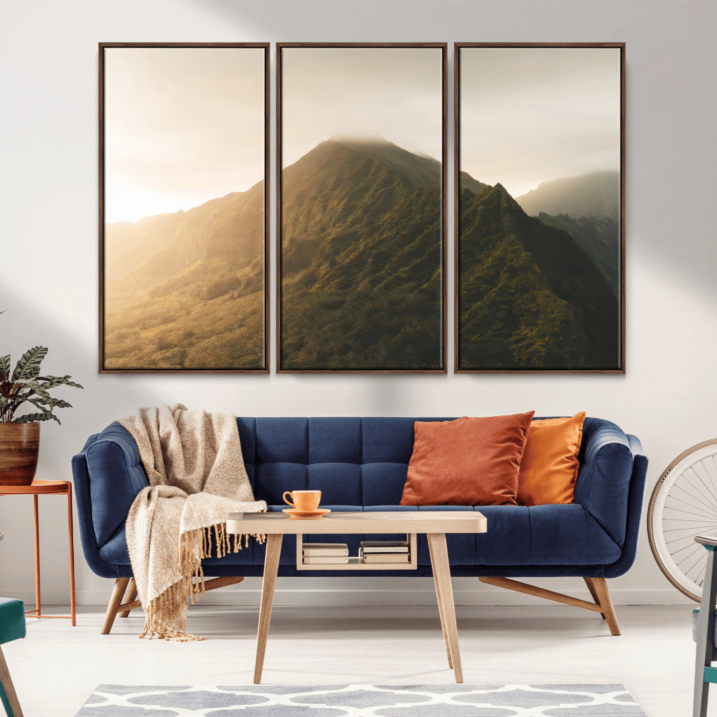 Sunlit mountain peak with mist rolling over its rugged slopes, bathed in golden light, creating a warm and tranquil nature-inspired scene.