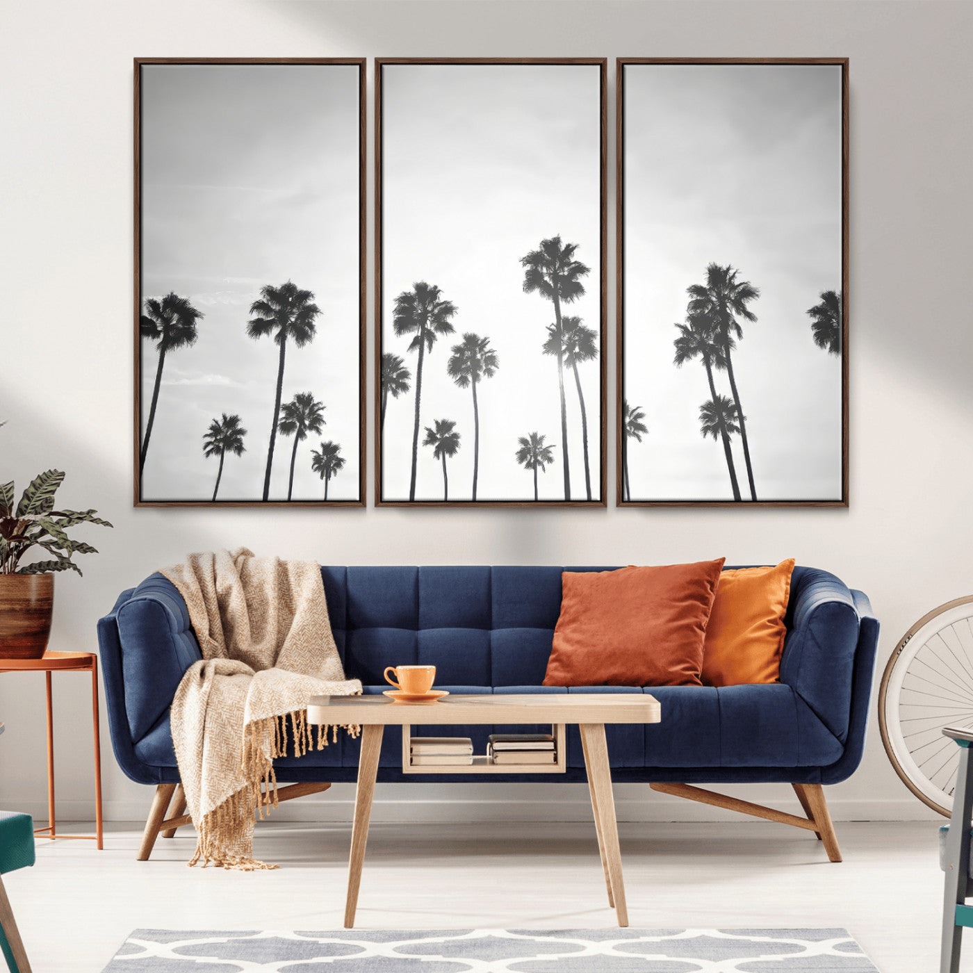 A black and white minimalist scene featuring tall palm trees silhouetted against a bright sky, creating a dreamy and timeless tropical aesthetic.