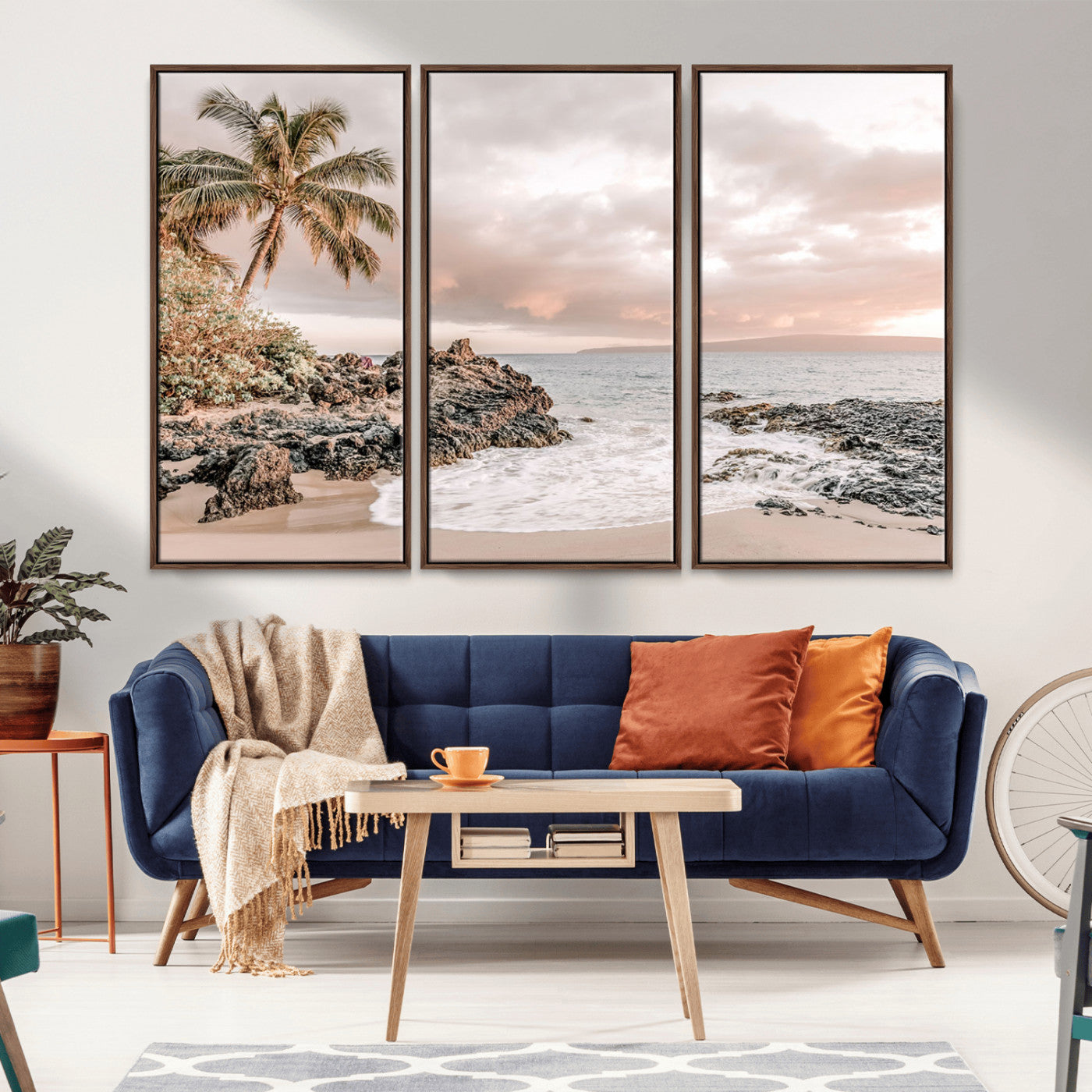 A peaceful beach scene with a palm tree and rocks, soft waves washing onto the shore under a soft pastel sky at sunset.