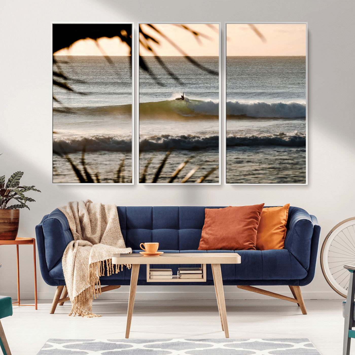 Photo of a surfer riding a golden hour wave at sunset, with tropical tones and dreamy light, perfect for tropical boho or coastal home decor.