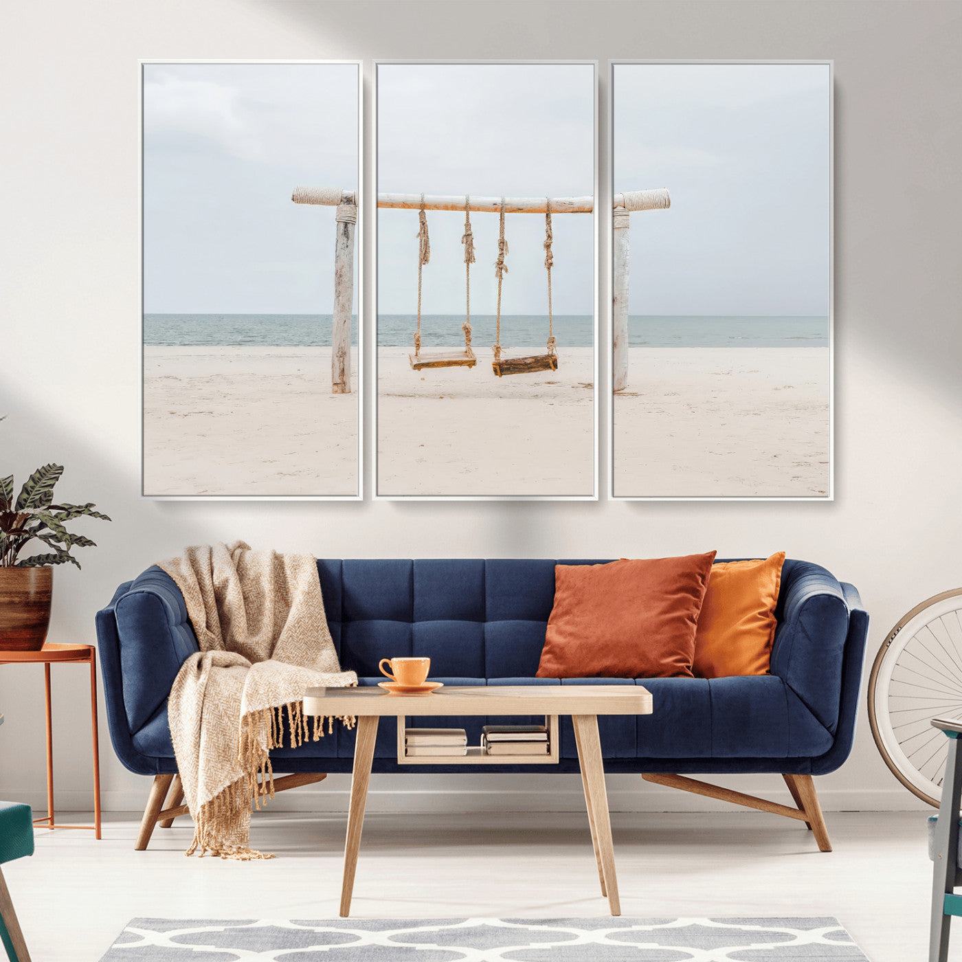 A rustic wooden beach swing stands on a serene sandy shore with an ocean horizon in the background, creating a tranquil and dreamy coastal escape.