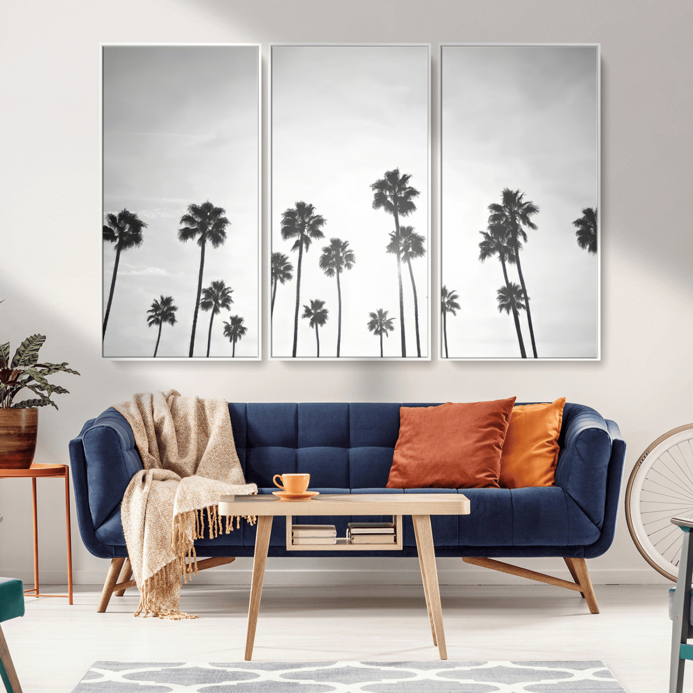 A black and white minimalist scene featuring tall palm trees silhouetted against a bright sky, creating a dreamy and timeless tropical aesthetic.
