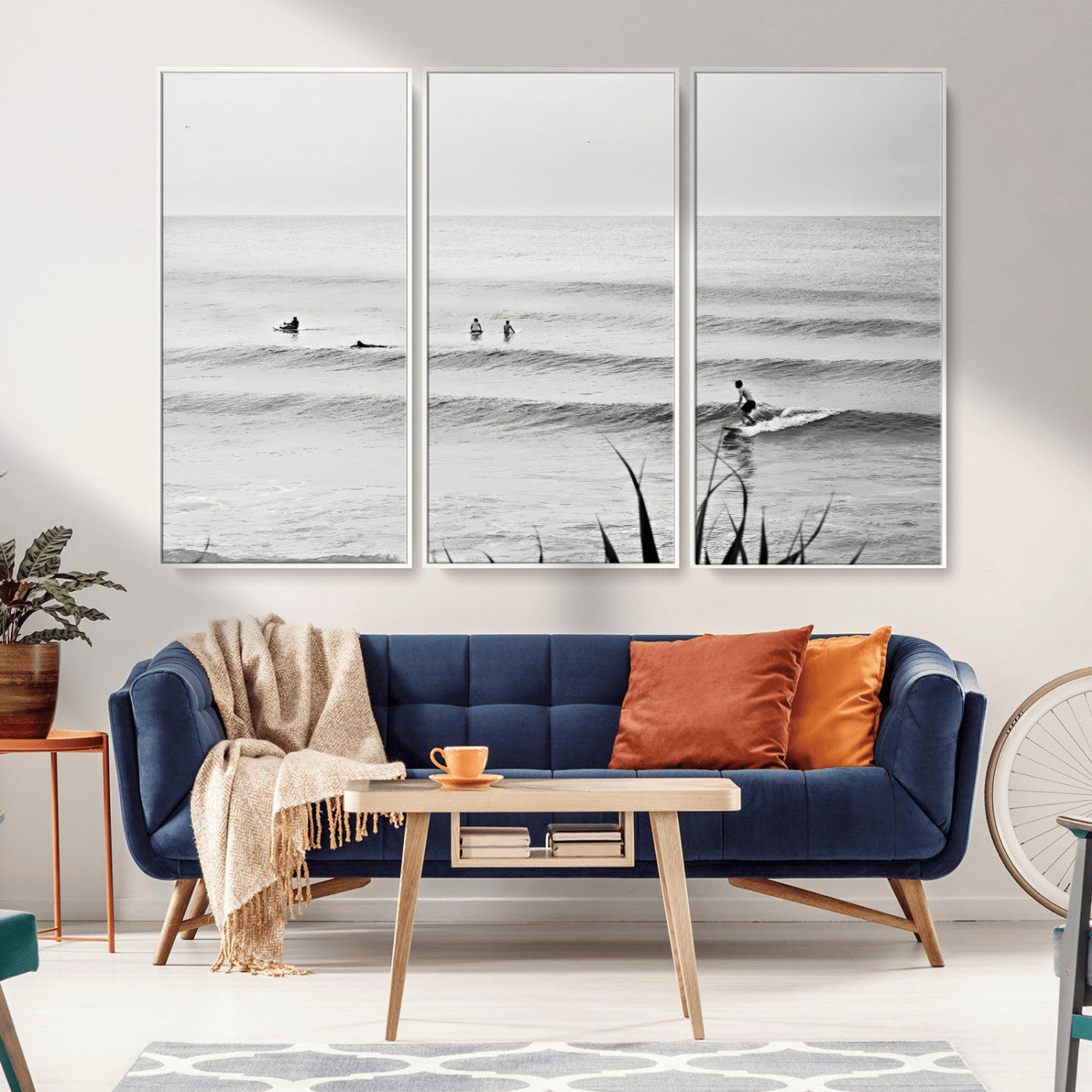 Monochrome canvas of surfers on calm ocean waves, ideal for minimalist coastal or beach-inspired interior decor.