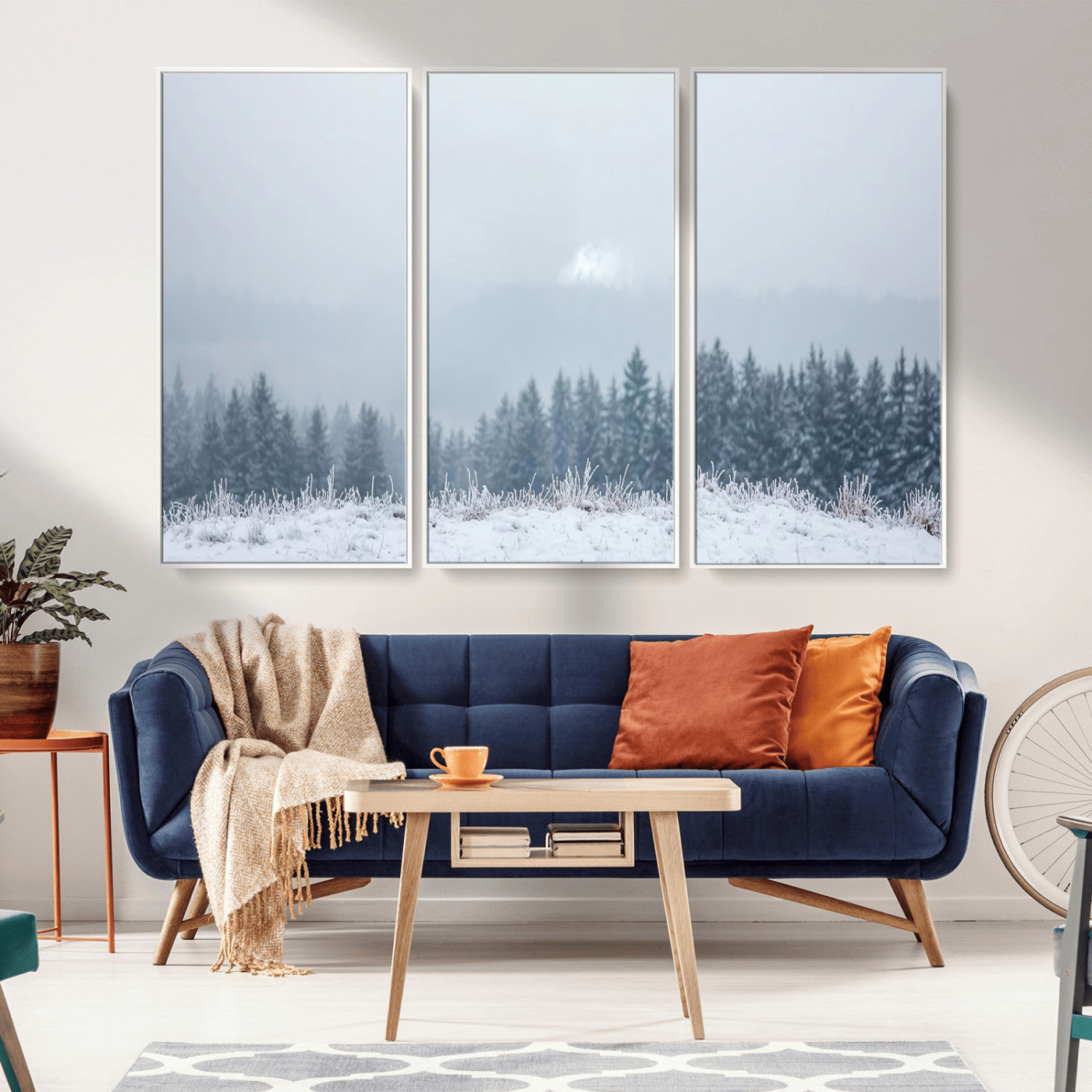 Snow-covered forest under misty sky, soft light breaking through clouds, ideal for minimalist or Nordic-inspired home decor.