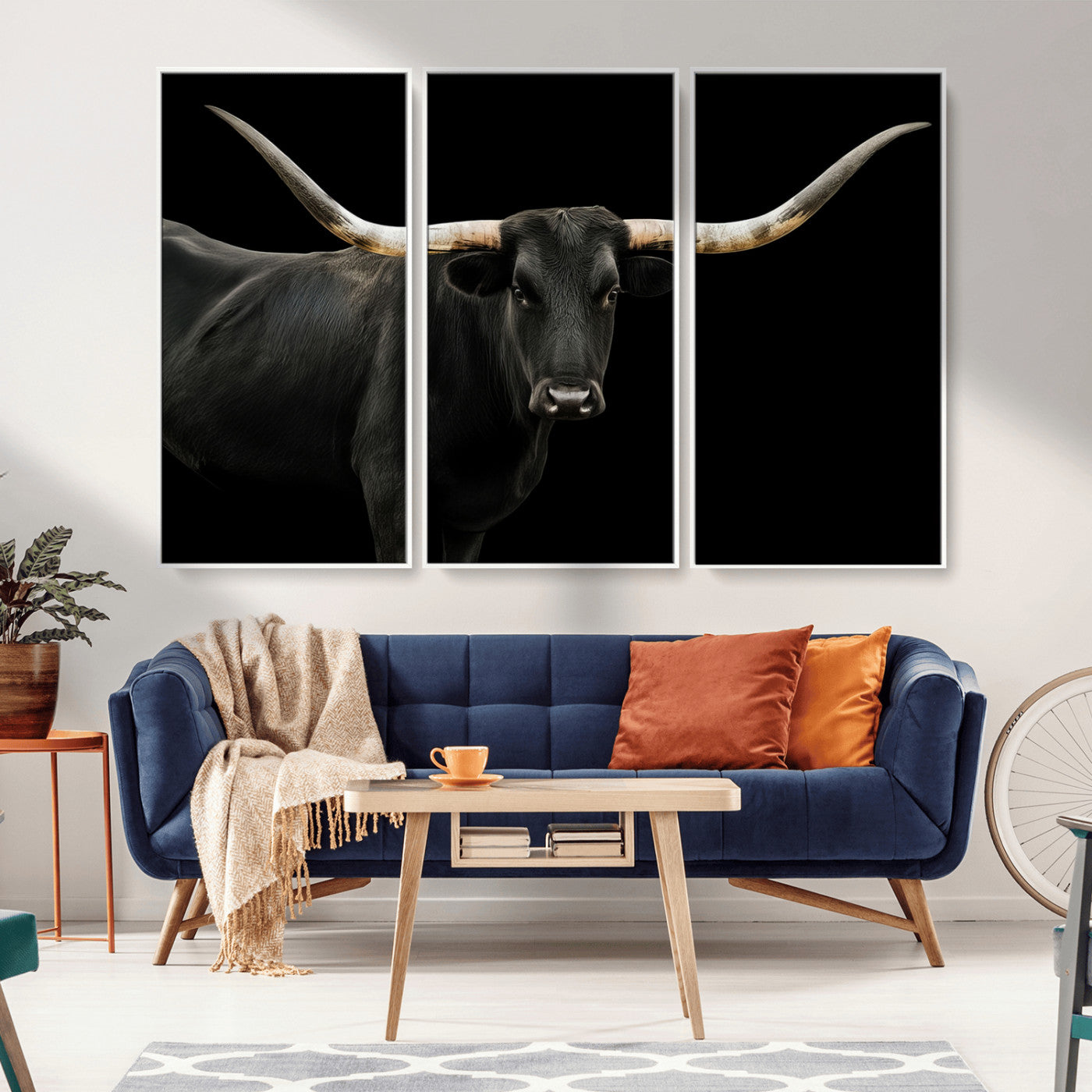 Close-up of a black Texas longhorn with large curved horns on black background, ideal for rustic farmhouse or modern western interiors.