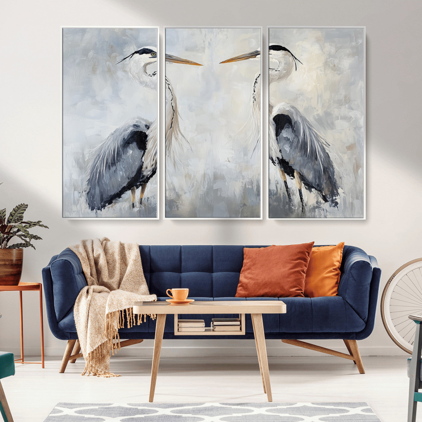 Two herons facing each other on a soft-toned background with blue-grey feathers, perfect for tranquil, coastal or nature-themed interiors.