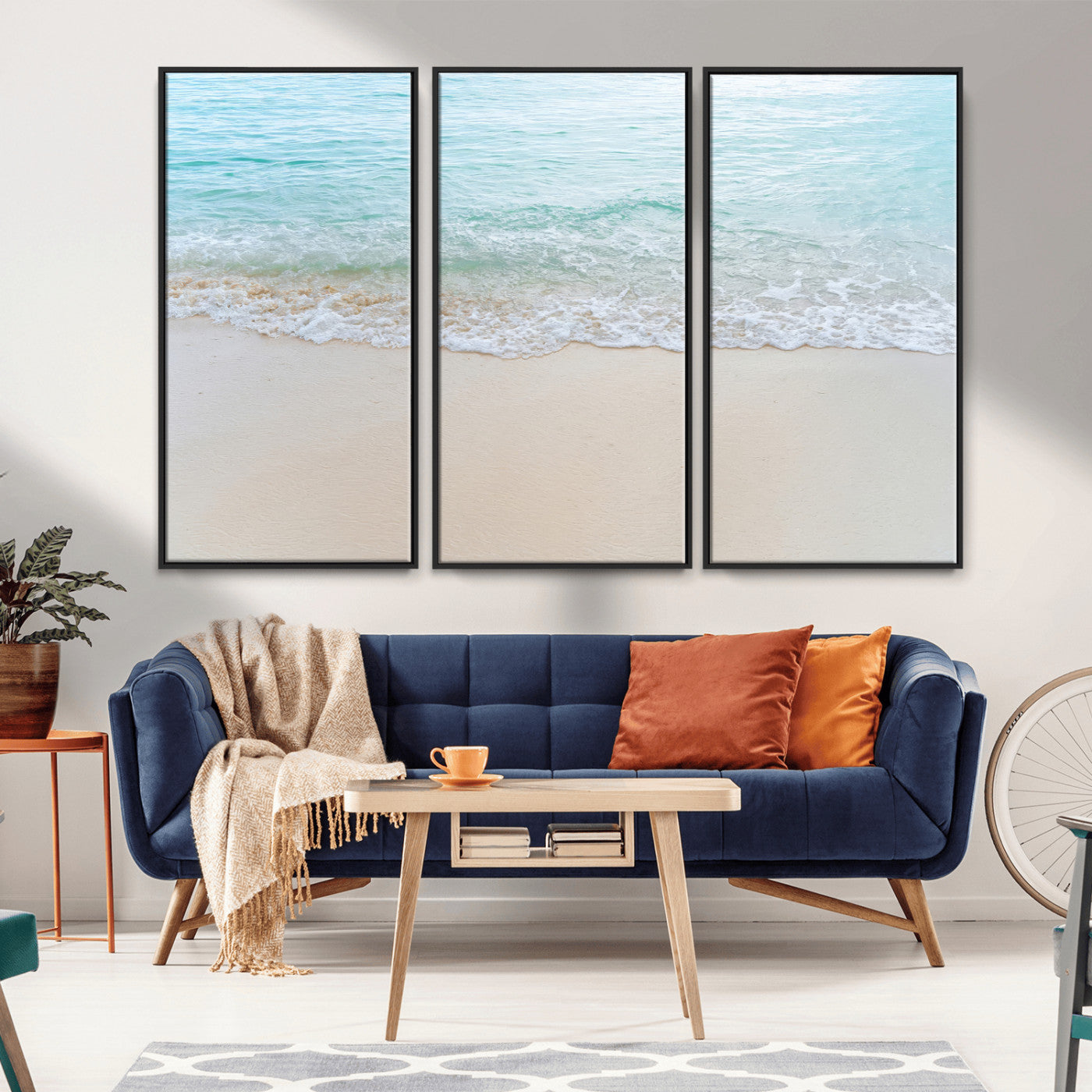 Soft shoreline with gentle aqua waves on smooth sand, ideal for minimalist coastal or pastel ocean-inspired home wall decor.