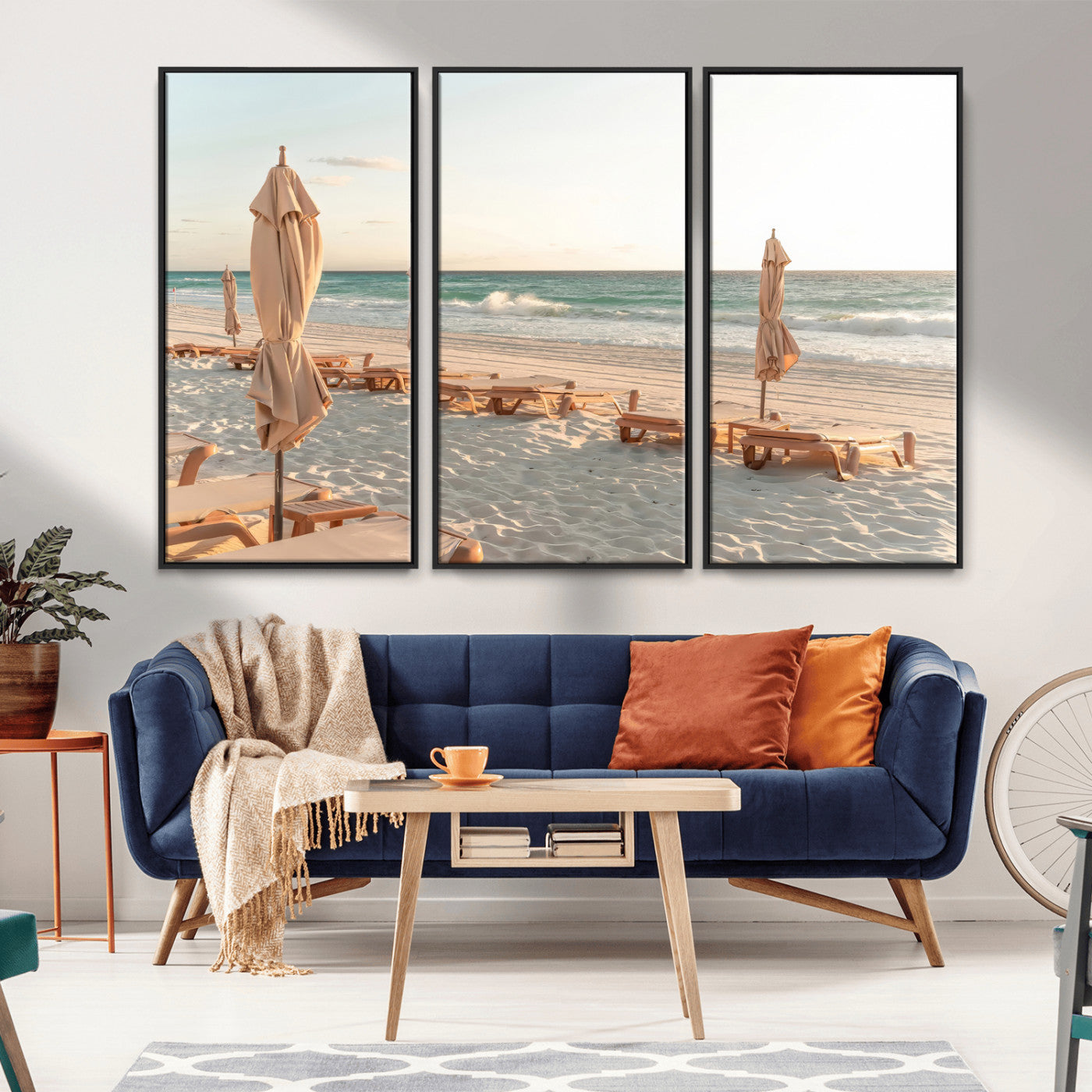 Minimalist photo of empty beach loungers and umbrellas on soft sand, ideal for calm seaside or pastel coastal-style home decor.