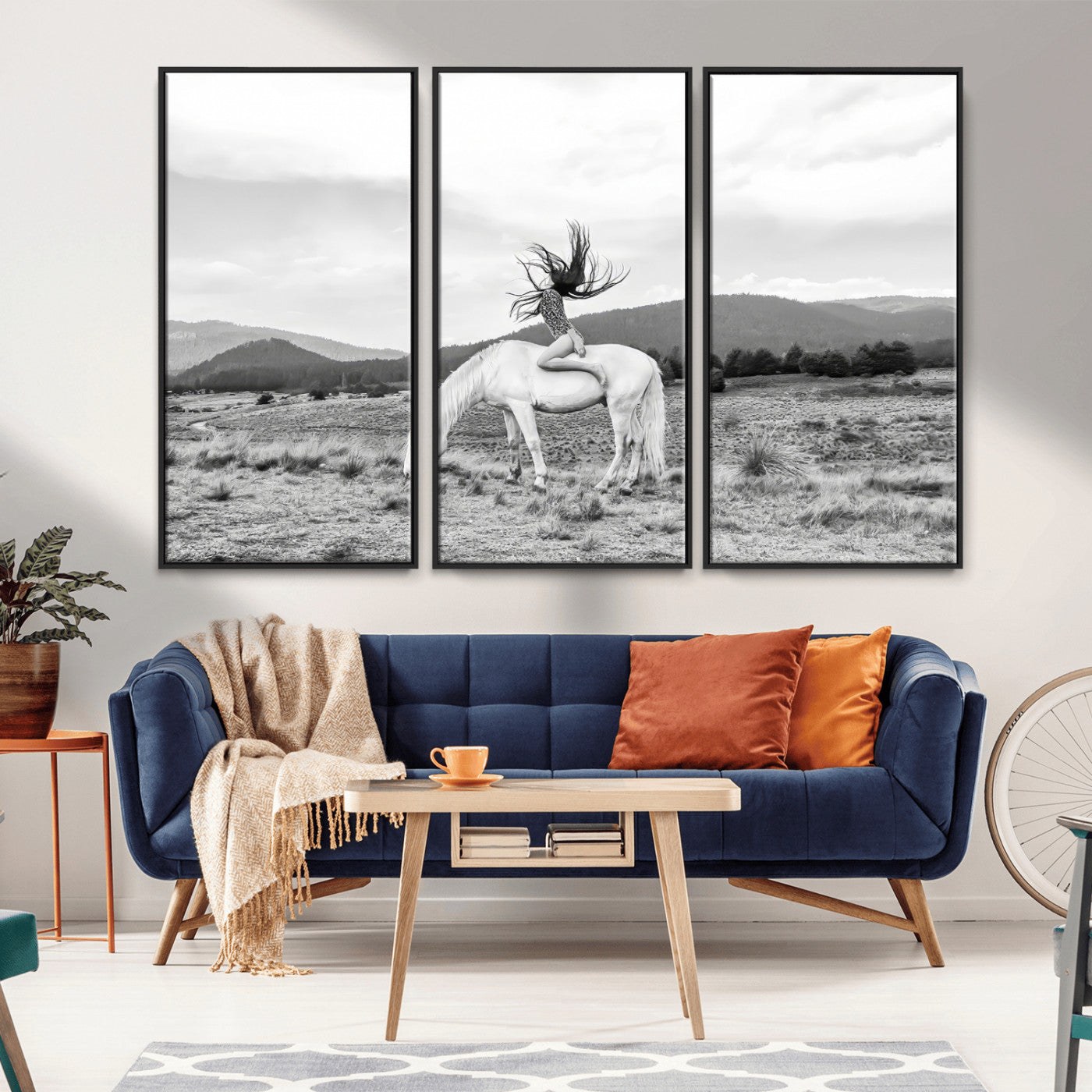 Black and white photo of a woman on a white horse in moody tones, ideal for Western Boho or modern rustic-style home decor.