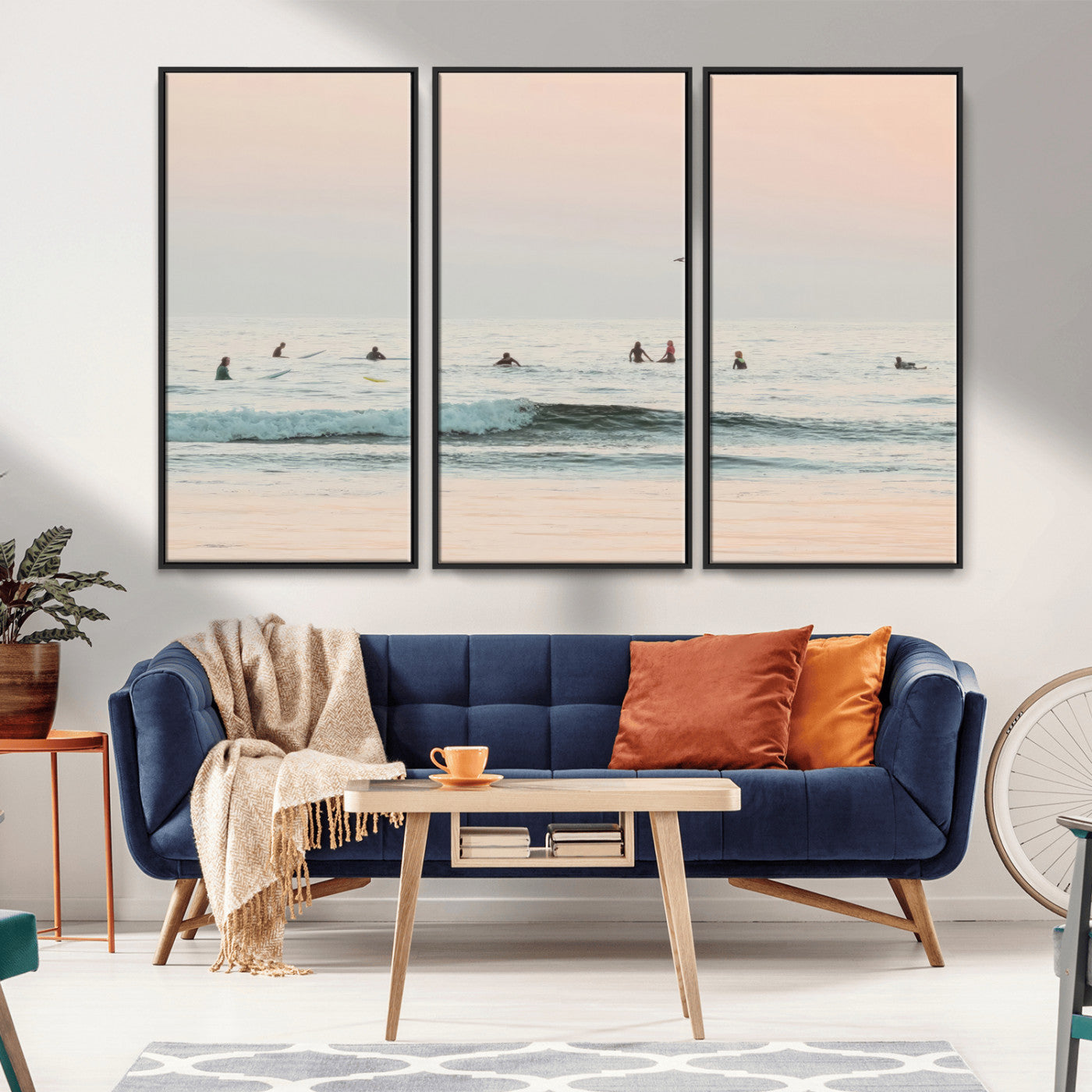 Dreamy photo of surfers waiting on soft pastel waves under a pink sunset sky, ideal for soft coastal minimalist or serene ocean-themed home decor.