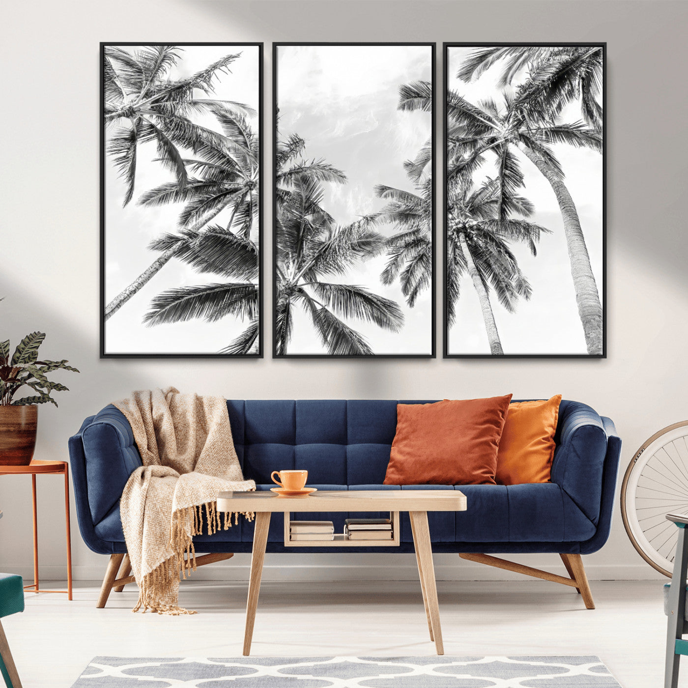 Black and white tropical palm trees viewed from below, swaying gently against a bright sky, creating a serene and elegant coastal atmosphere.