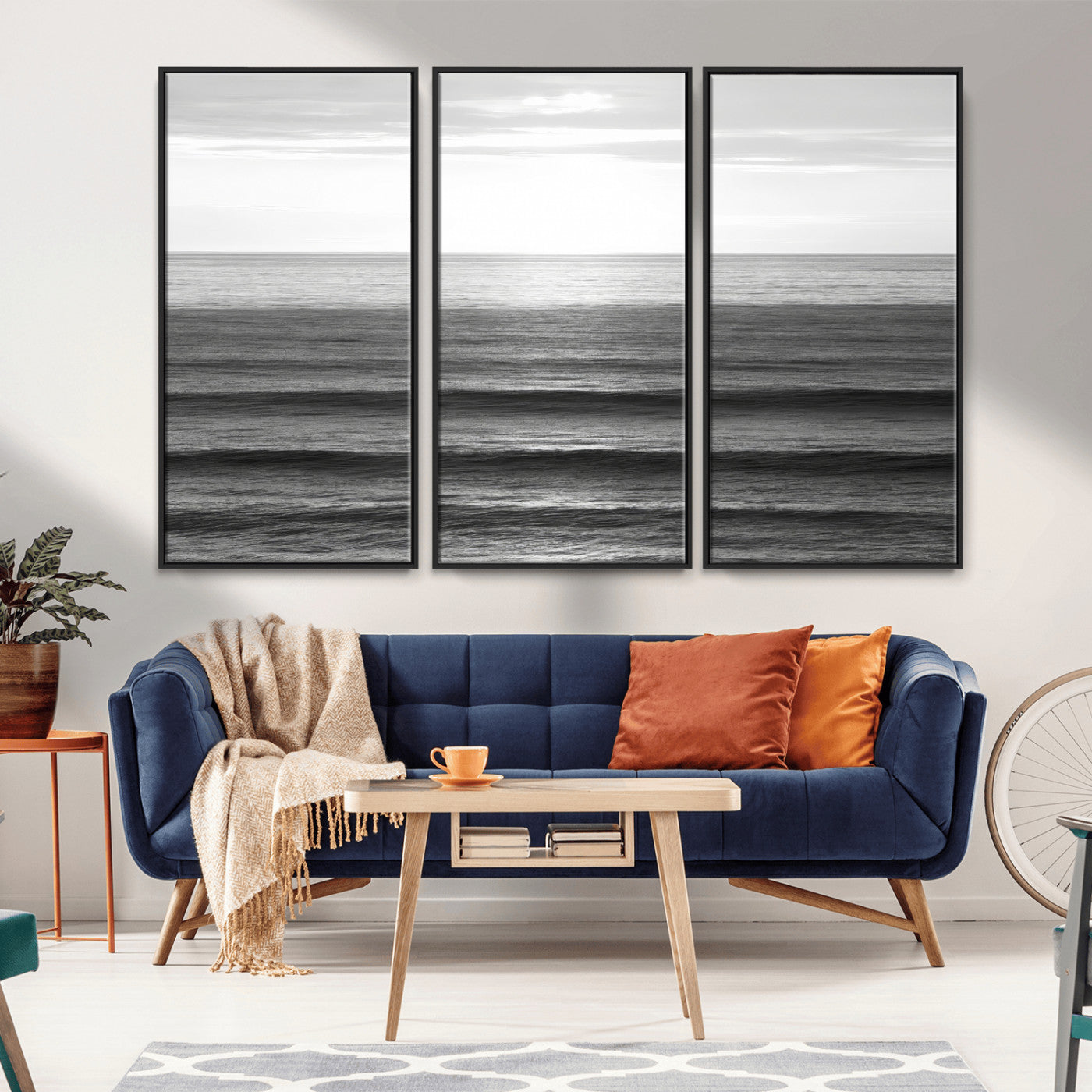 Minimalist black and white ocean view with layered waves reflecting sunlight, evoking a sense of calm and coastal serenity.