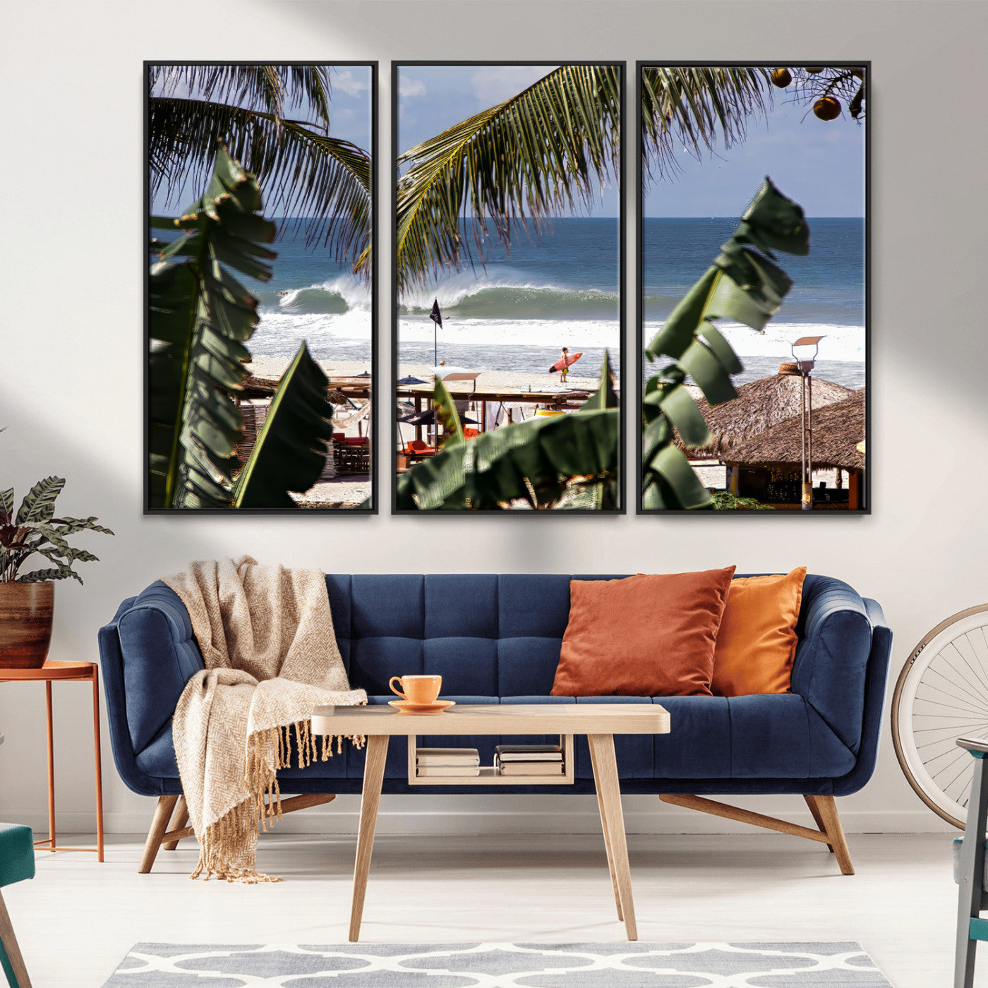 Canvas wall art of a tropical surf scene framed by palm trees, with a surfer on the shore and waves rolling in, ideal for beach-themed decor.