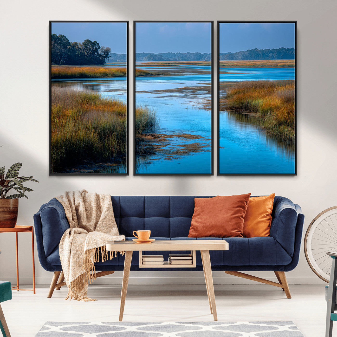 A peaceful marshland scene with calm blue water reflecting the surrounding grasses and trees, capturing the beauty of nature in a serene landscape.