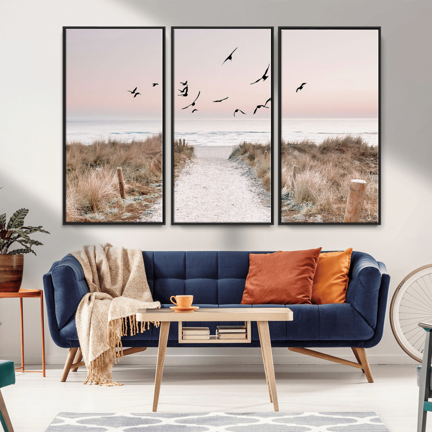 A peaceful coastal pathway leading to the ocean, with birds flying across a soft pastel sky, creating a calm and scenic beach atmosphere.