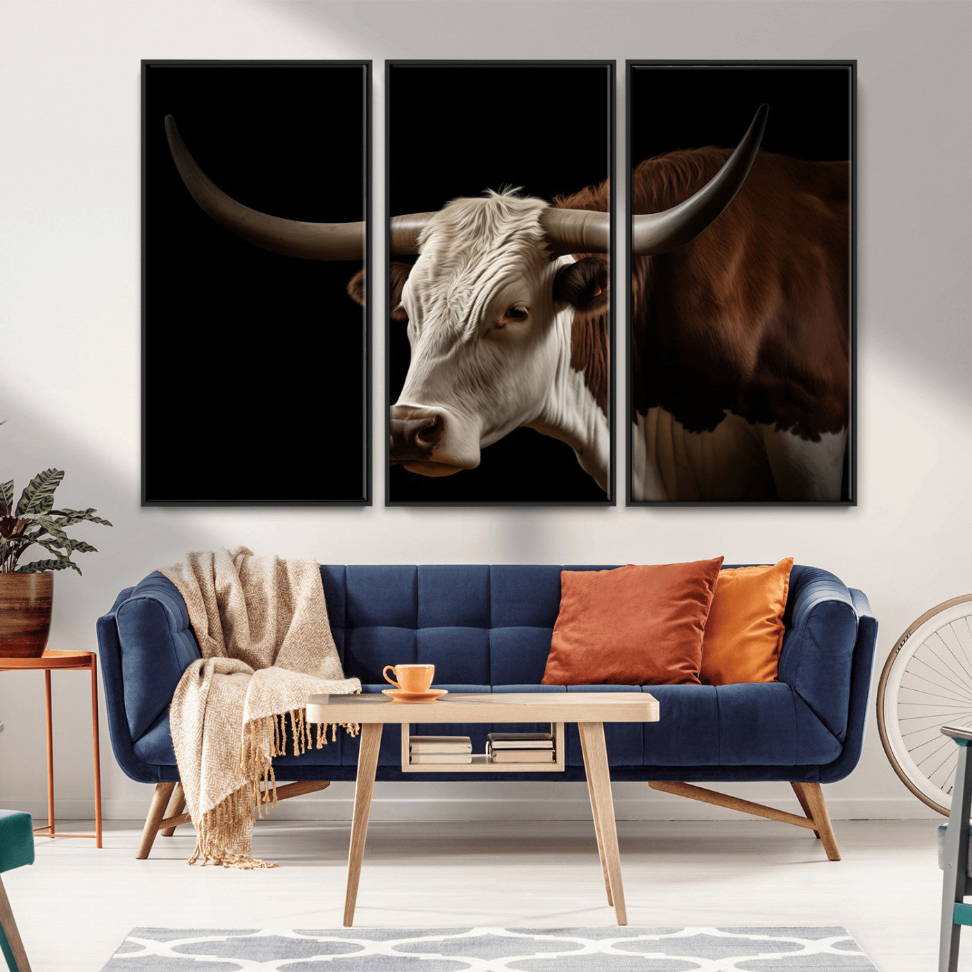 "Close-up of a brown and white longhorn cow with prominent curved horns against a black background."