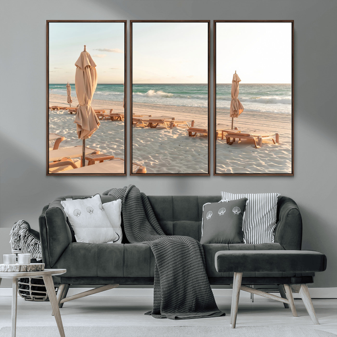 Minimalist photo of empty beach loungers and umbrellas on soft sand, ideal for calm seaside or pastel coastal-style home decor.