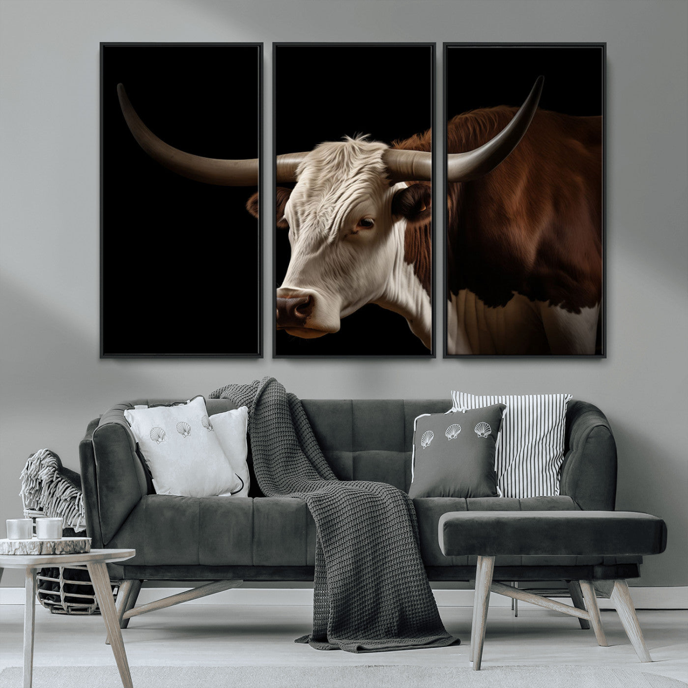"Close-up of a brown and white longhorn cow with prominent curved horns against a black background."