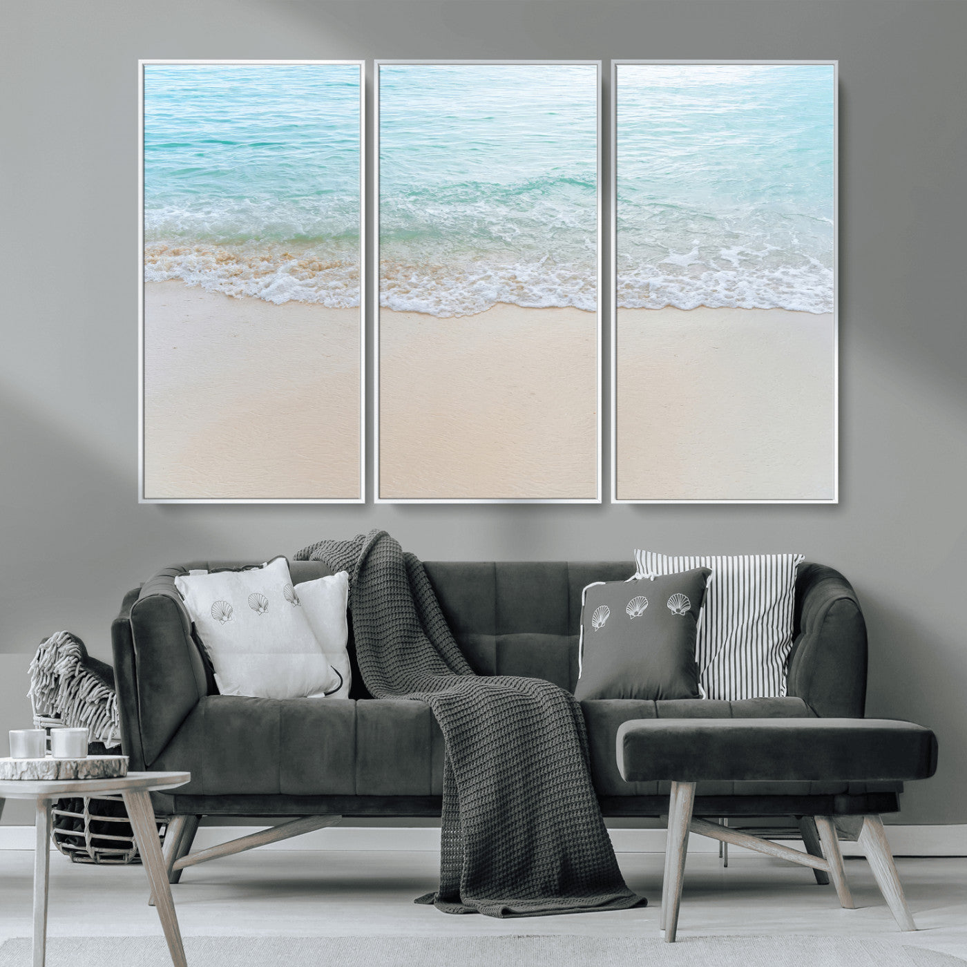 Soft shoreline with gentle aqua waves on smooth sand, ideal for minimalist coastal or pastel ocean-inspired home wall decor.