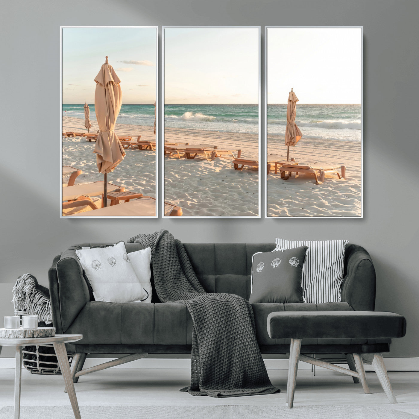 Minimalist photo of empty beach loungers and umbrellas on soft sand, ideal for calm seaside or pastel coastal-style home decor.