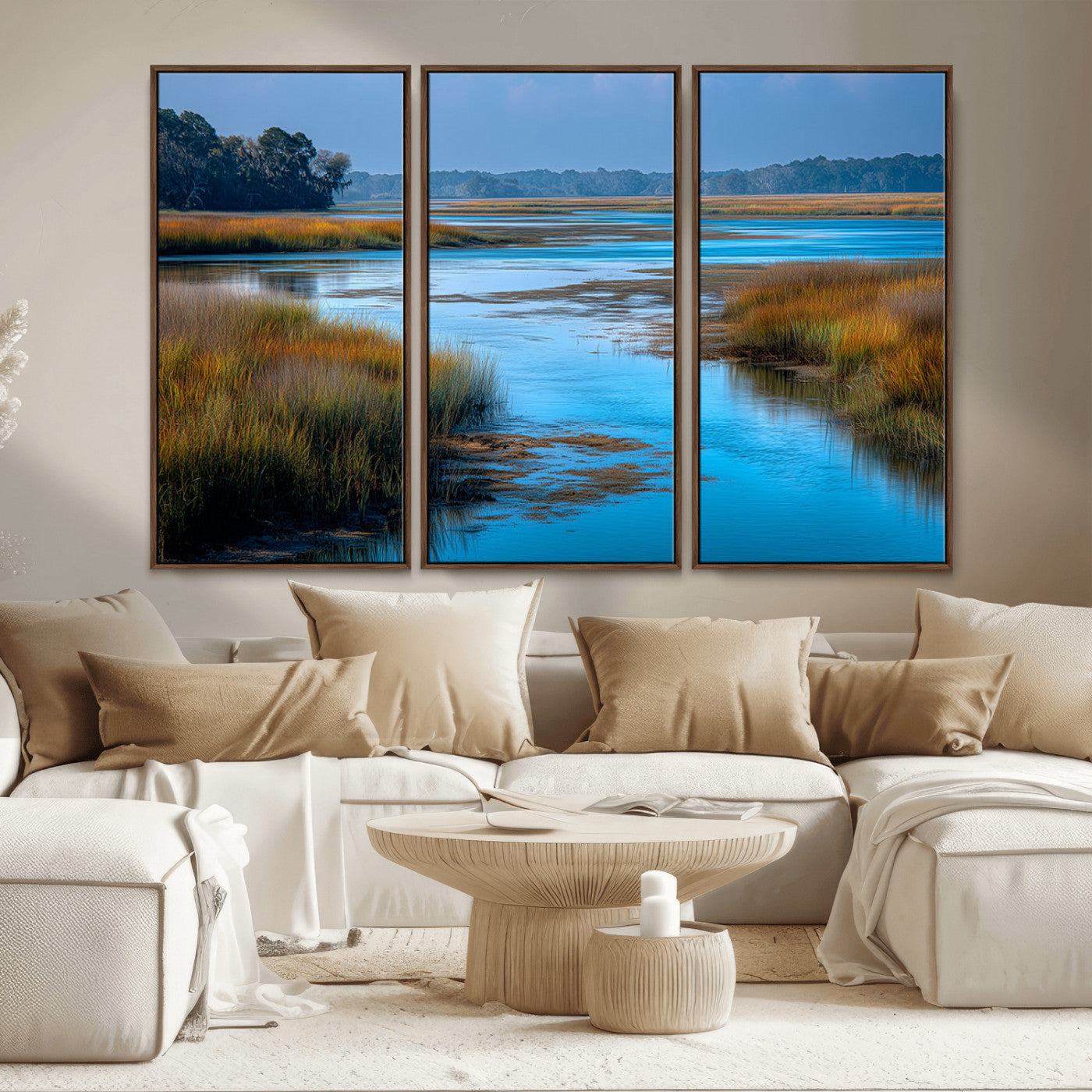 A peaceful marshland scene with calm blue water reflecting the surrounding grasses and trees, capturing the beauty of nature in a serene landscape.