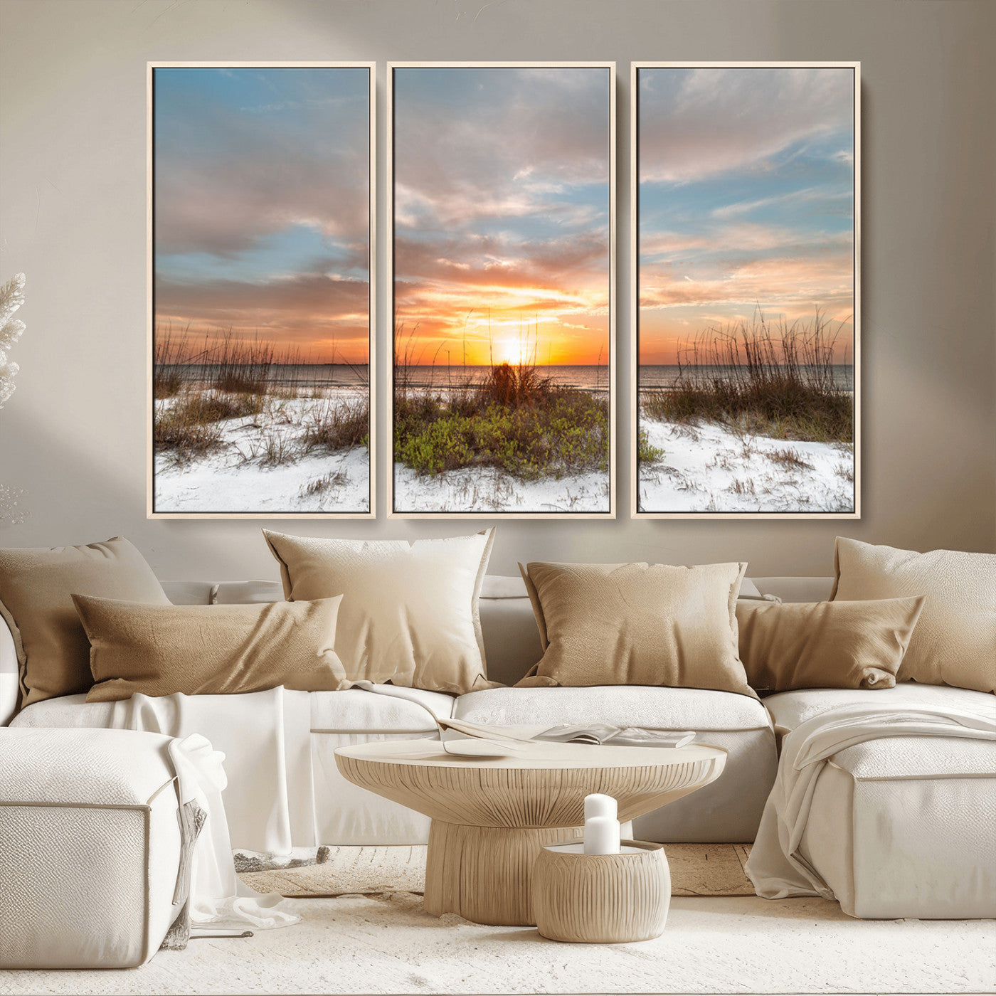 A tranquil beach scene featuring golden sunset hues over the water, with grasses in the foreground and a peaceful, serene atmosphere.