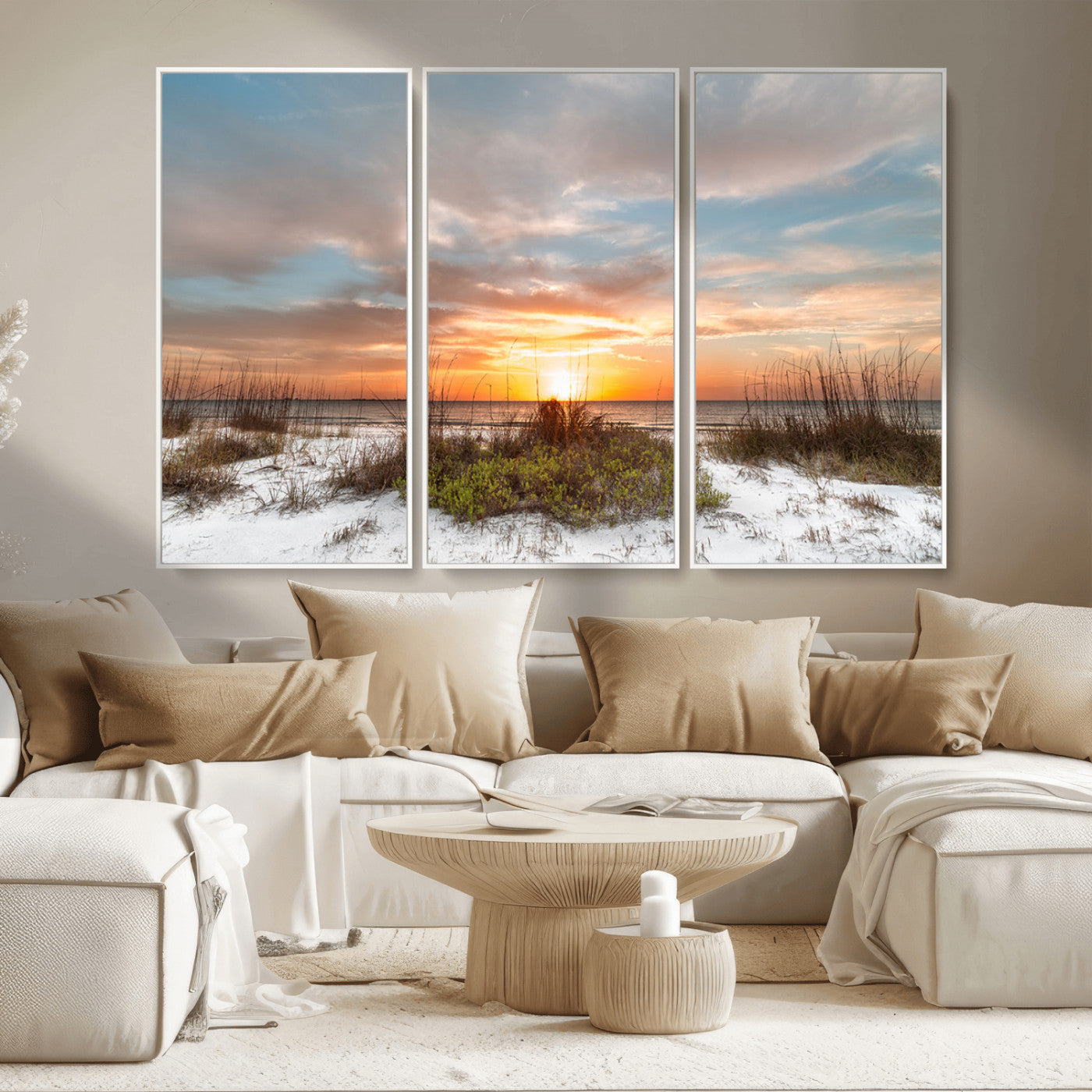 A tranquil beach scene featuring golden sunset hues over the water, with grasses in the foreground and a peaceful, serene atmosphere.