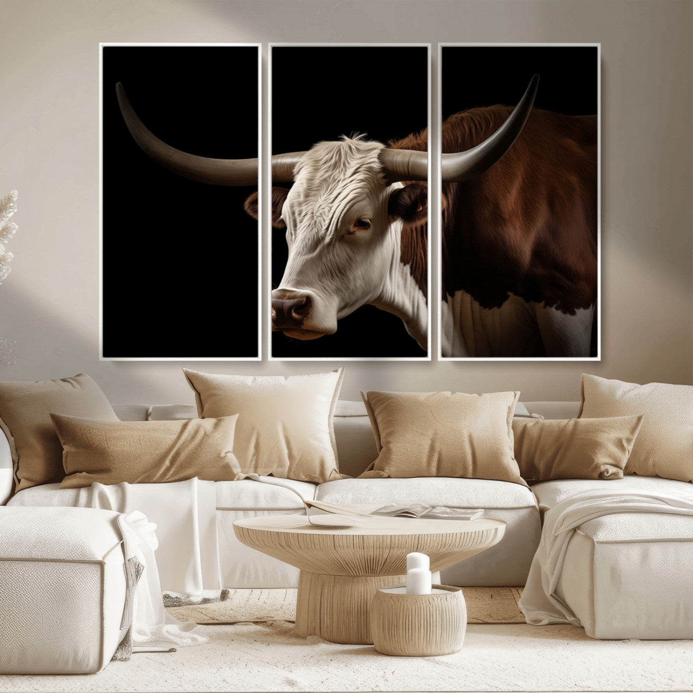 "Close-up of a brown and white longhorn cow with prominent curved horns against a black background."