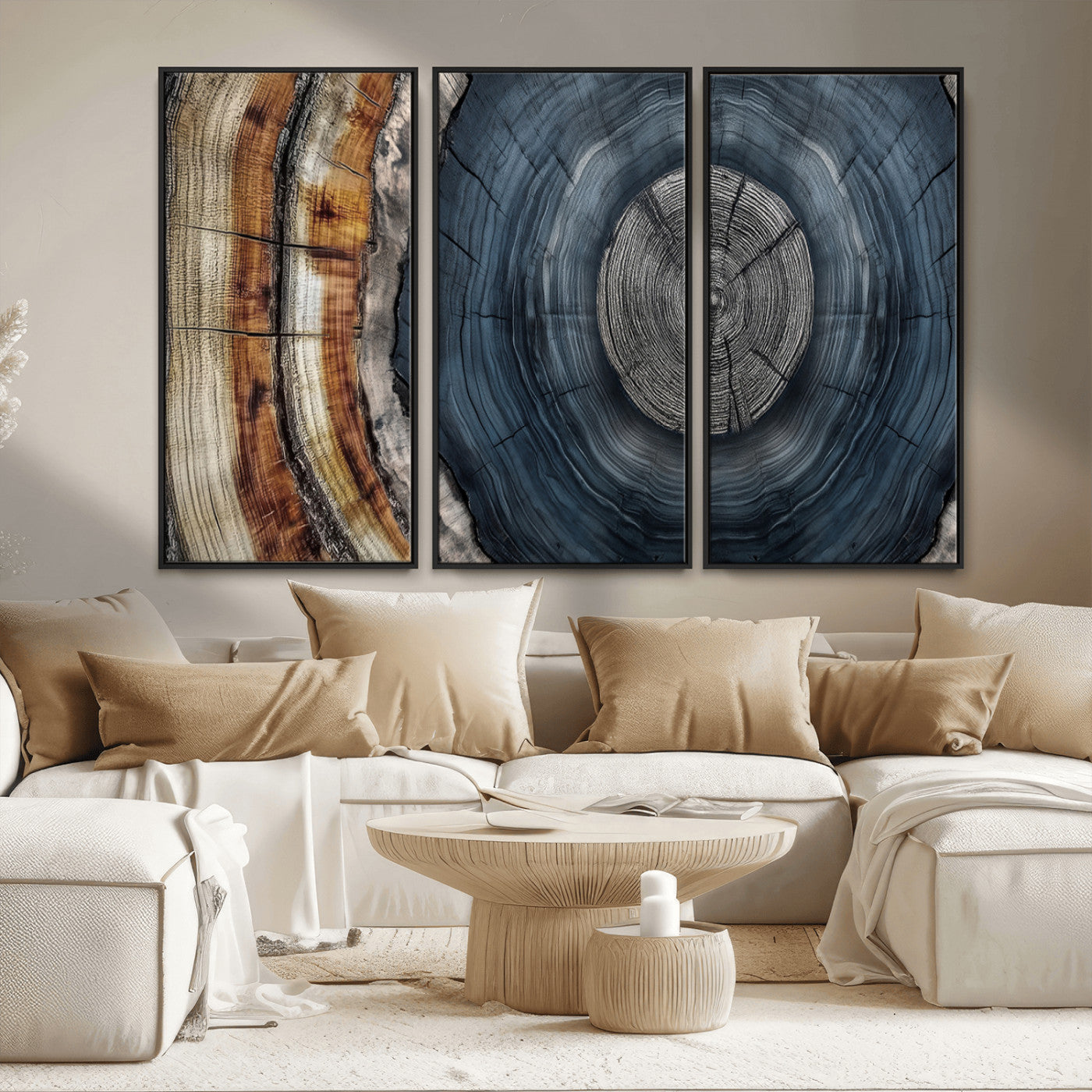 A stunning close-up of a tree trunk showing the intricate, circular growth rings, showcasing the natural textures and rich contrasts in deep blues, browns, and silvers.