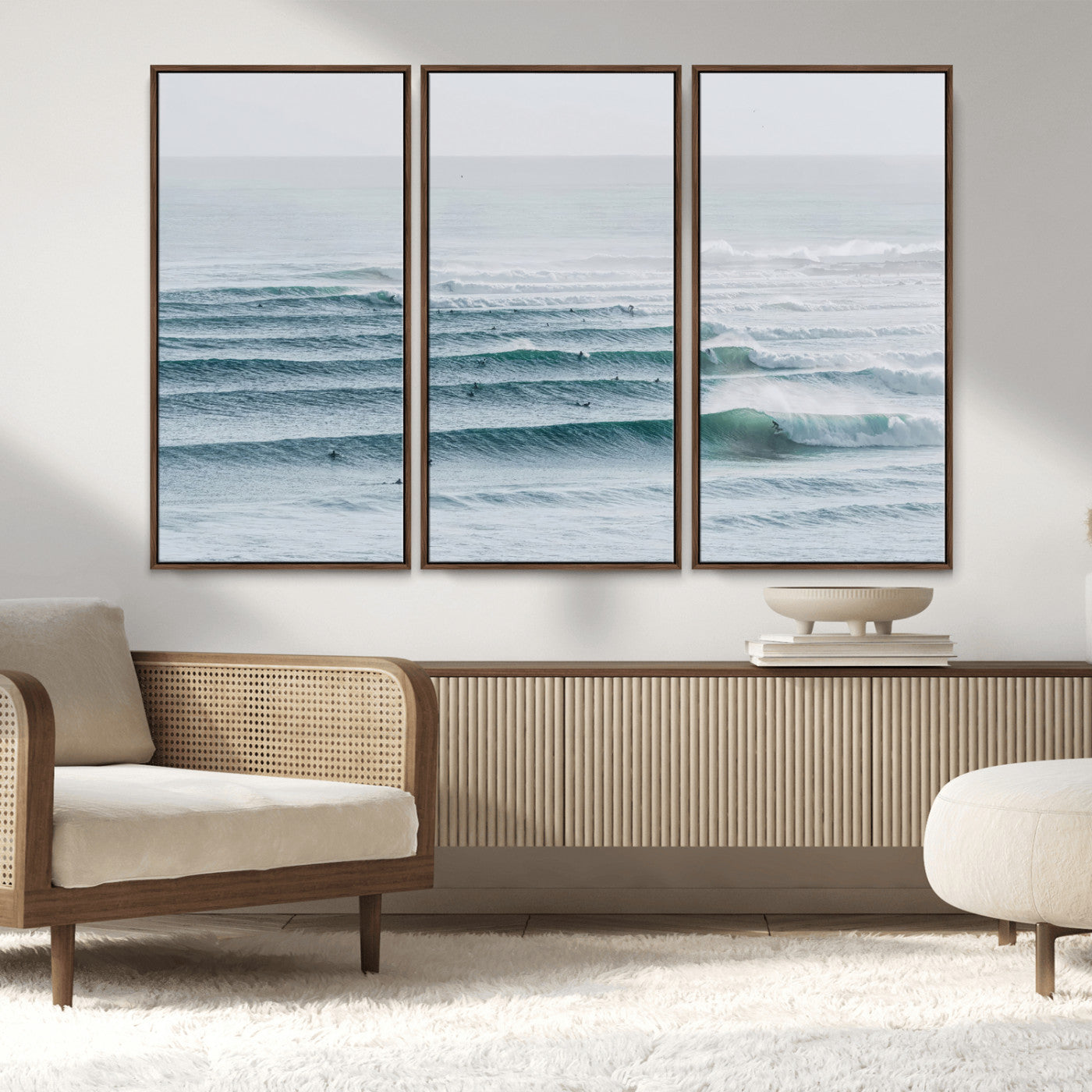 High-angle view of surfers lining up across layered ocean waves, ideal for minimal coastal or surf-inspired room decor.