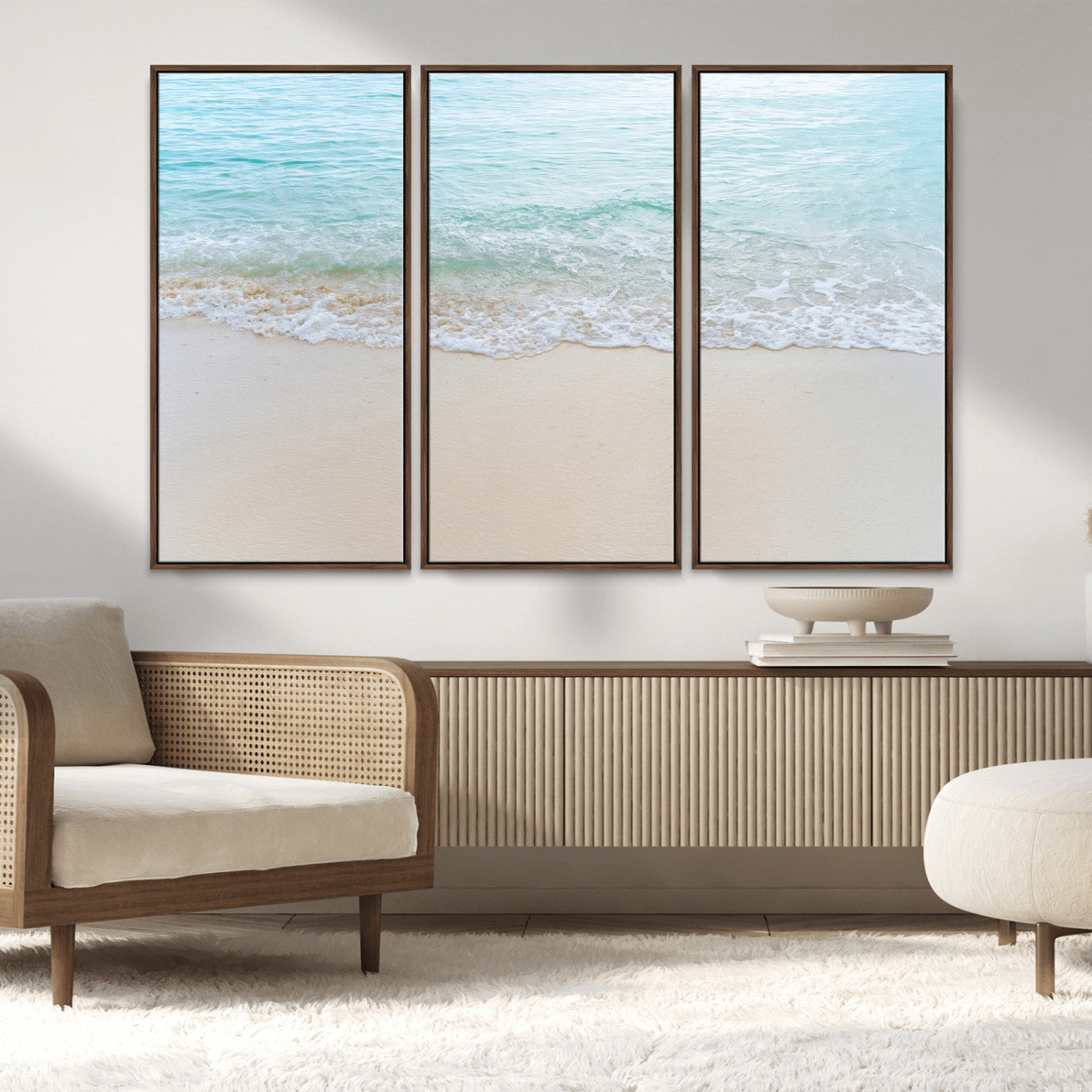 Soft shoreline with gentle aqua waves on smooth sand, ideal for minimalist coastal or pastel ocean-inspired home wall decor.