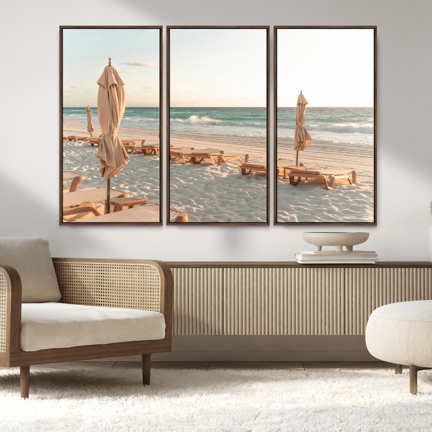 Minimalist photo of empty beach loungers and umbrellas on soft sand, ideal for calm seaside or pastel coastal-style home decor.