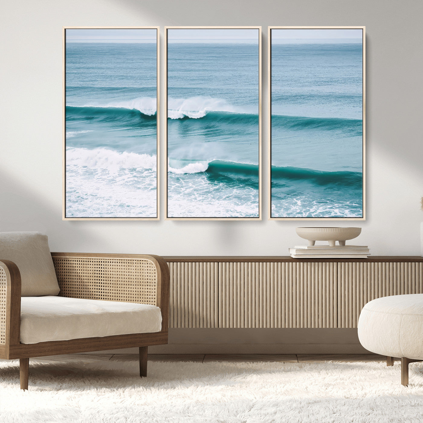 Powerful ocean waves rolling towards the shore, their turquoise hues blending with white sea foam under an open horizon, capturing the essence of the ocean's movement.