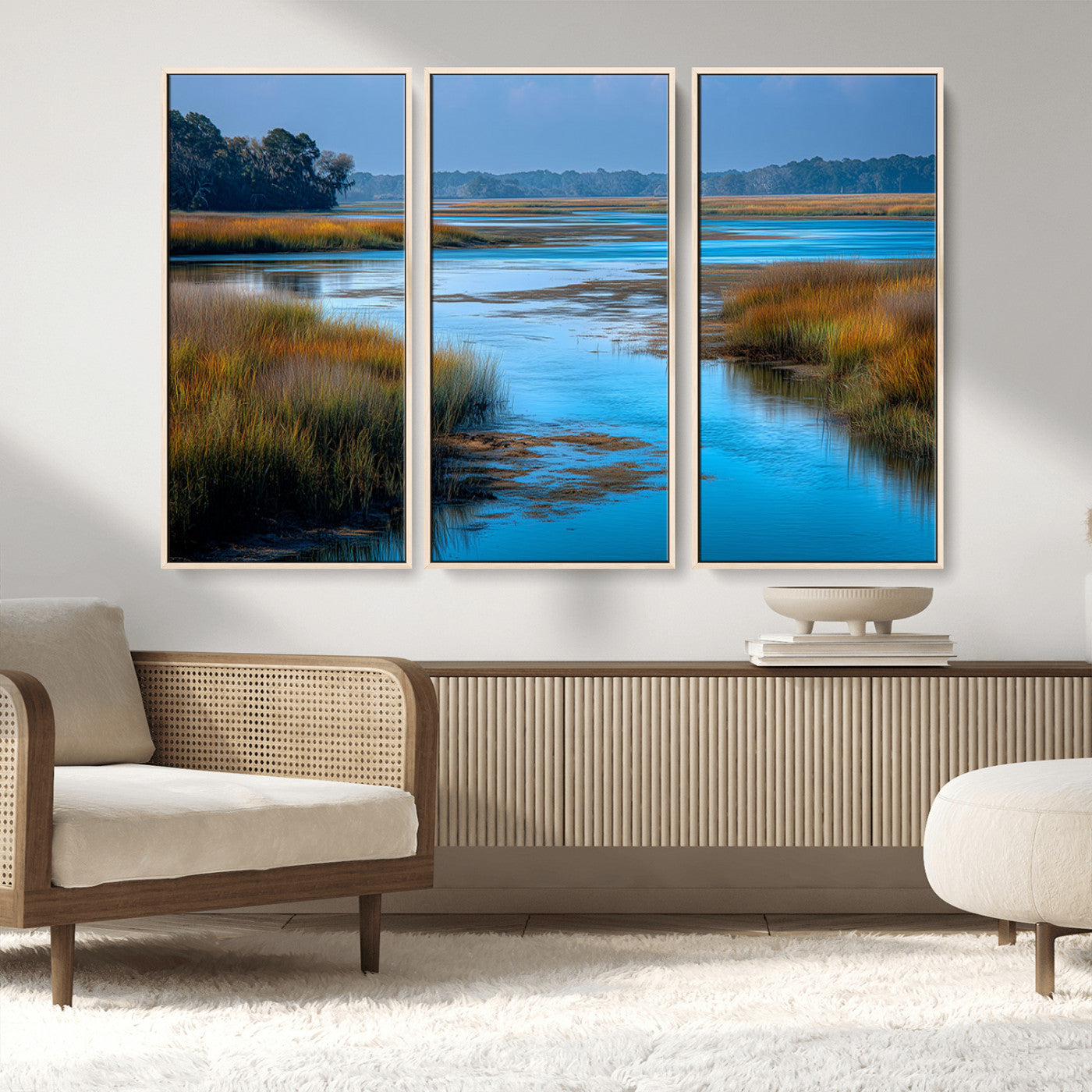 A peaceful marshland scene with calm blue water reflecting the surrounding grasses and trees, capturing the beauty of nature in a serene landscape.