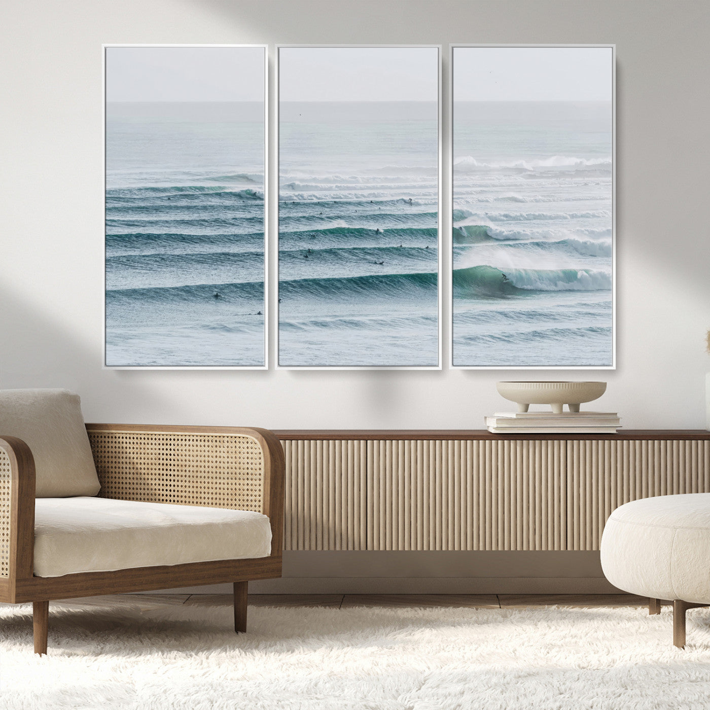 High-angle view of surfers lining up across layered ocean waves, ideal for minimal coastal or surf-inspired room decor.