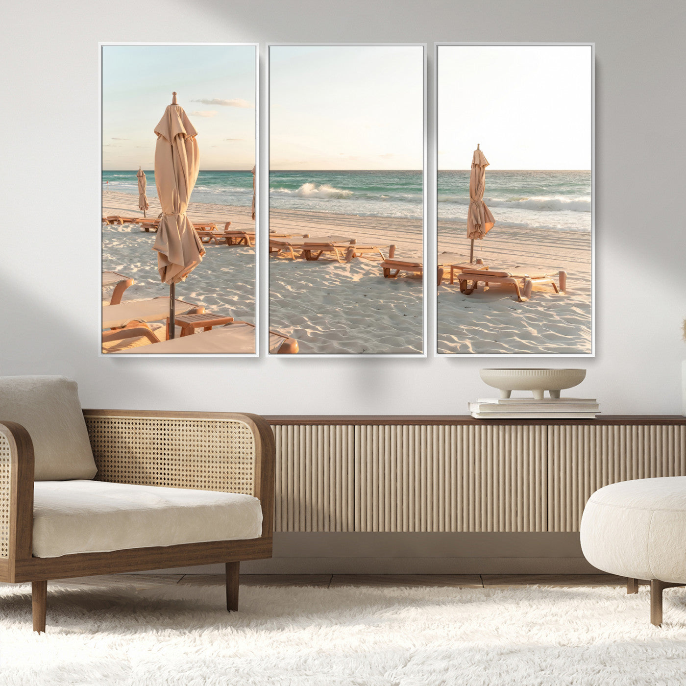 Minimalist photo of empty beach loungers and umbrellas on soft sand, ideal for calm seaside or pastel coastal-style home decor.