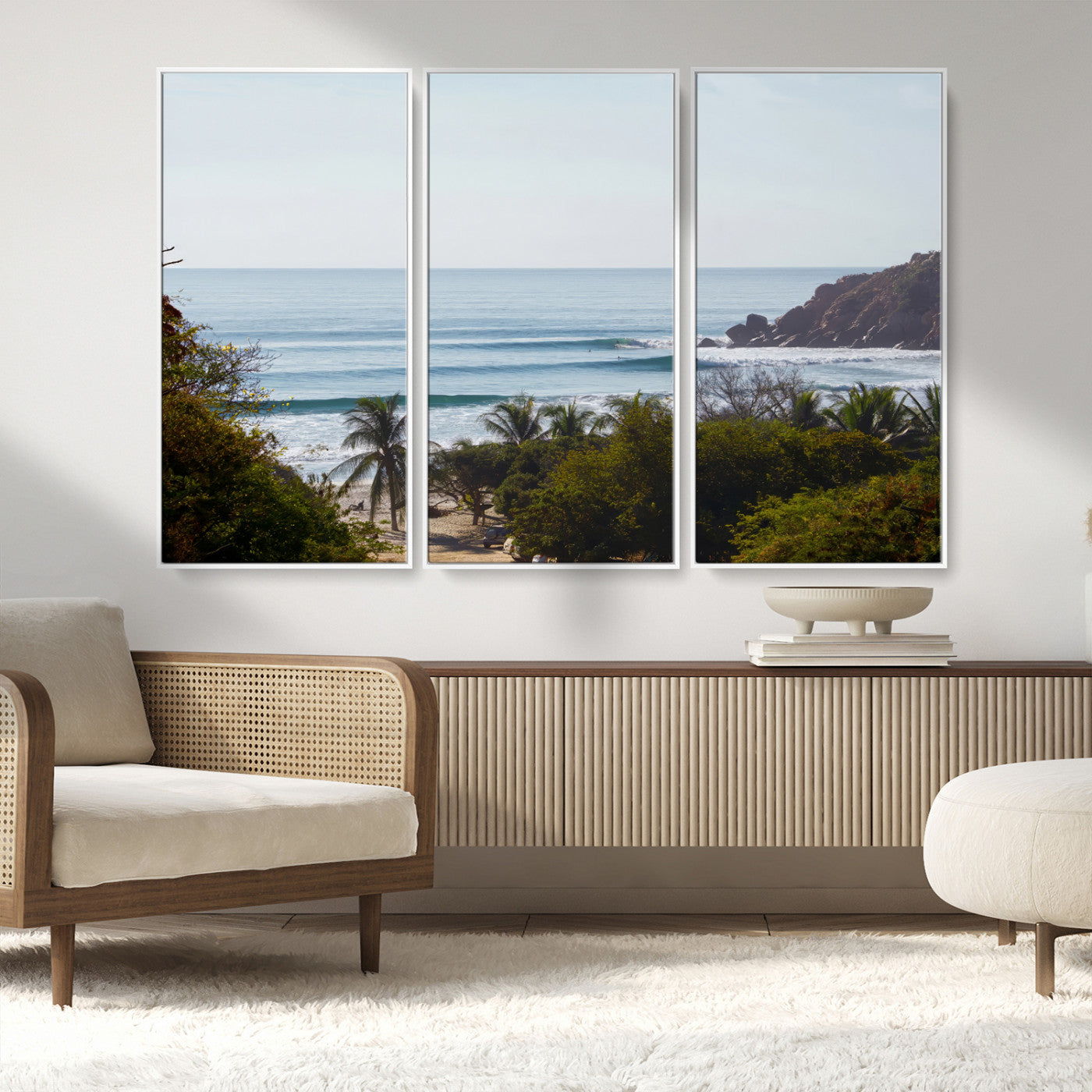 View of calm ocean waves with palm trees and a tropical coastline, ideal for coastal boho or beach-themed wall decor.