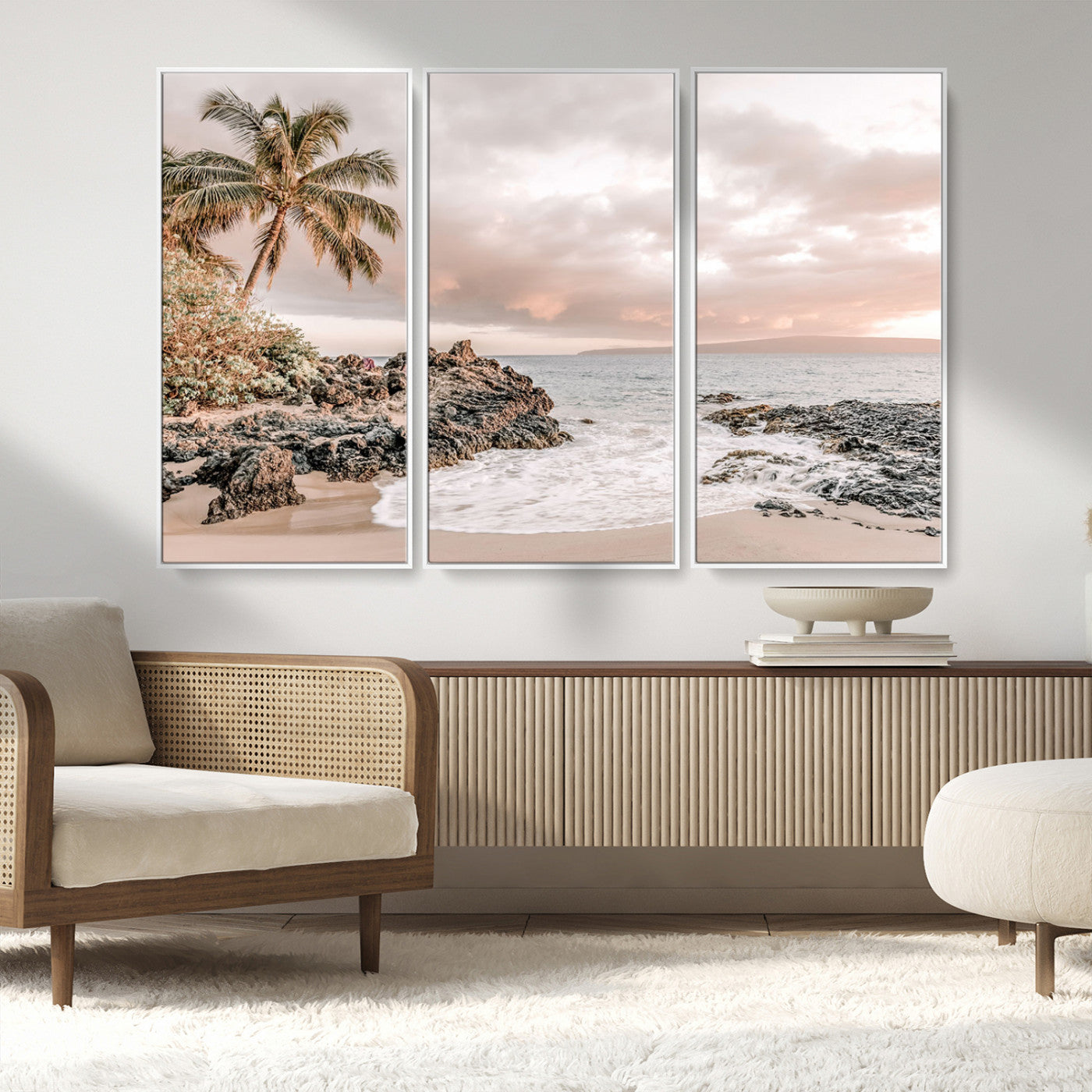 A peaceful beach scene with a palm tree and rocks, soft waves washing onto the shore under a soft pastel sky at sunset.