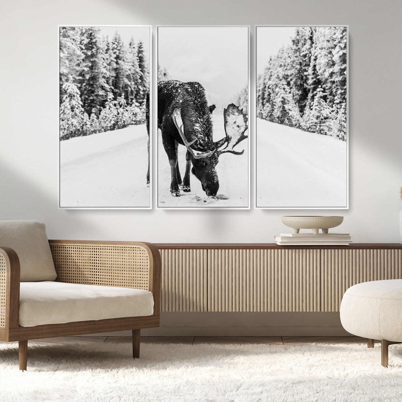 A majestic moose grazing in the snow-covered wilderness, surrounded by snow-covered trees, creating a peaceful winter scene.
